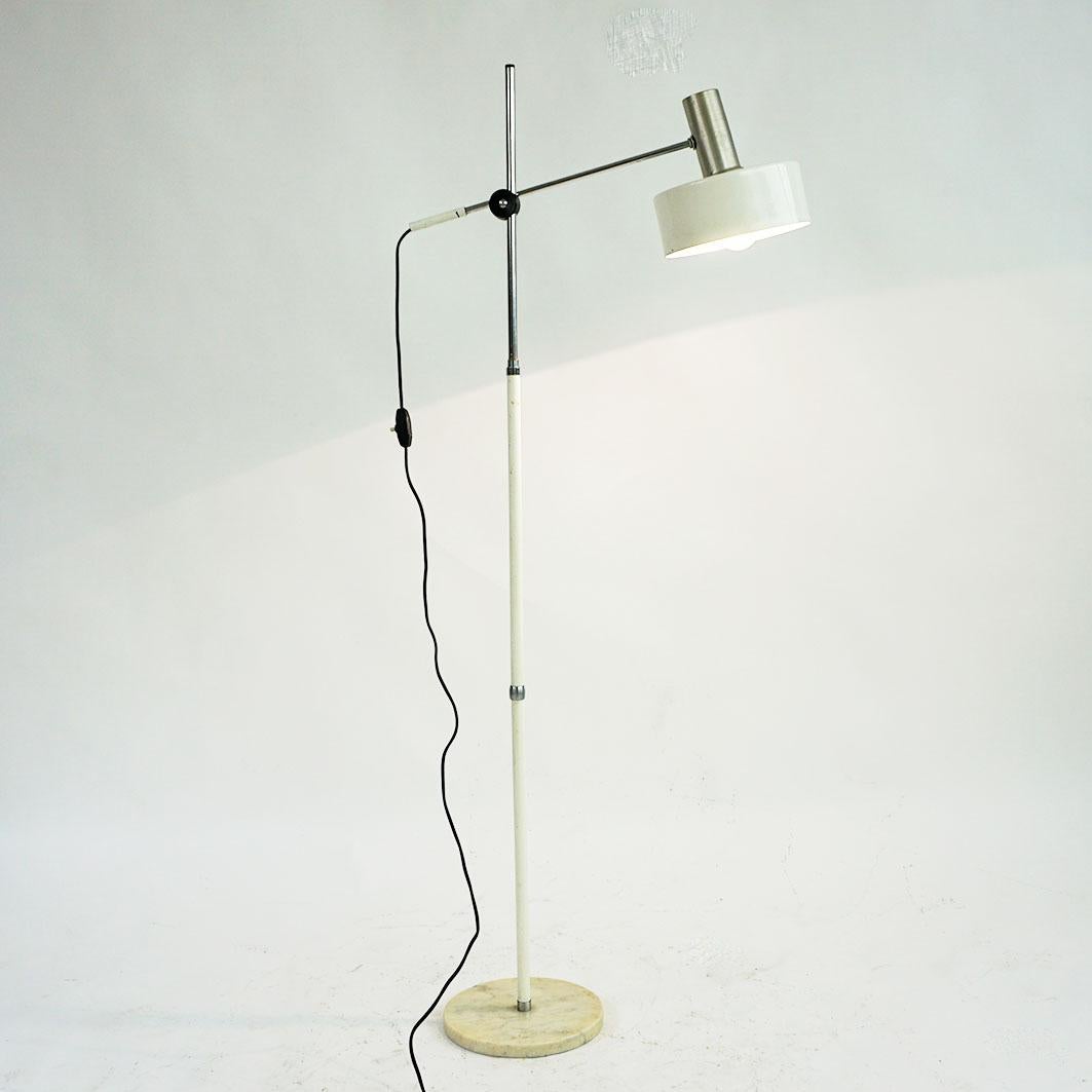 This amazing adjustable Space Age Floorlamp has been designed and manufactured in Italy 1960s. It features a steel stem, marble base and a adjustable white lacquered Aluminum shade. It is in fully working condition and in nice original vintage