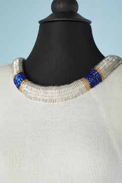 White jersey cocktail dress with beaded neckline edge and back Circa 1980's