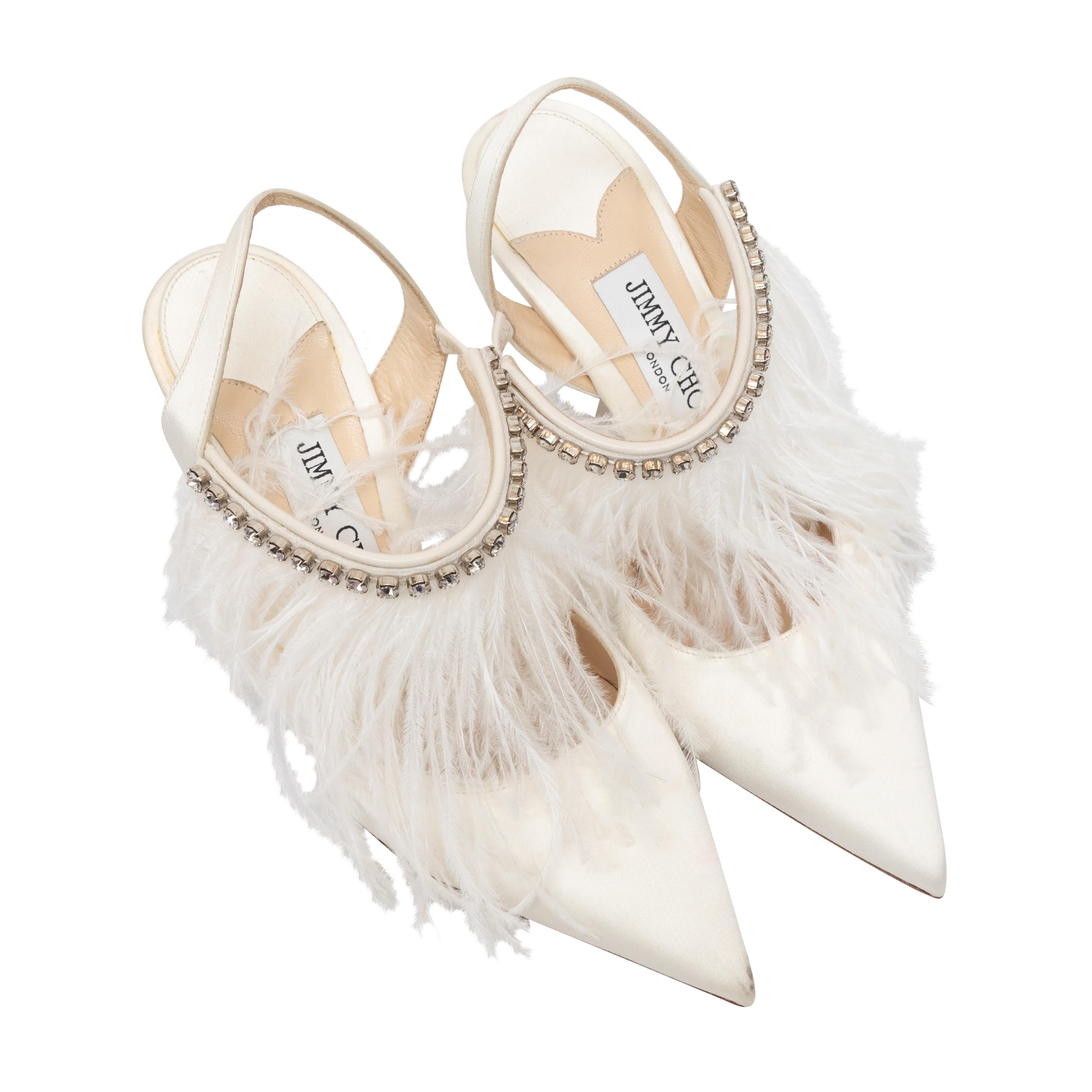 White satin ostrich feather and crystal-embellished pointed-toe slingbacks by Jimmy Choo. 3