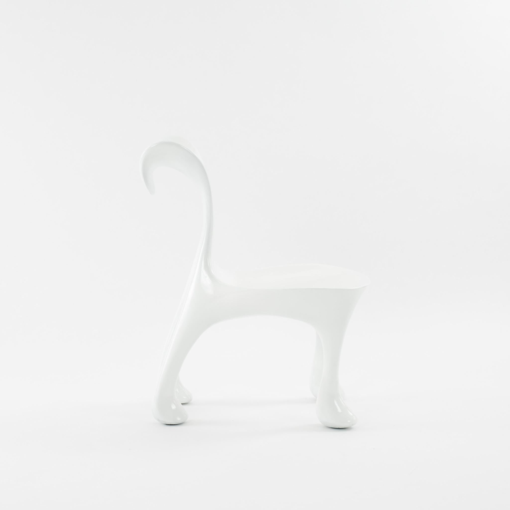 Iconic fiberglass Hoodie chair designed by architect Jordan Mozer for award-winning Nicaraguan-born Chef Michael Cordua's famed Américas restaurant in Houston, Texas. *Drawing/rendering/photograph by Jordan Mozer.

This artful chair has beautifully