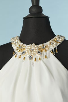 White jumpsuit with beadwork around the neckline Gai Mattiolo Love to Love