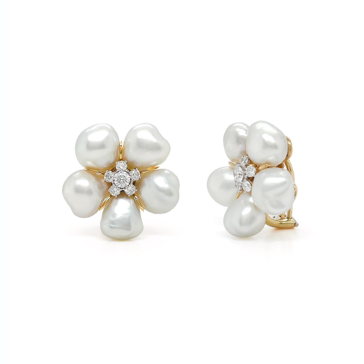 The satin glow of Keshi pearls is complemented by radiant diamonds for these earrings. Five unique pearls bloom forming the shape of a flower. In the center, five brilliant cut diamonds surround a single diamond. 18kt yellow gold sets the pattern.