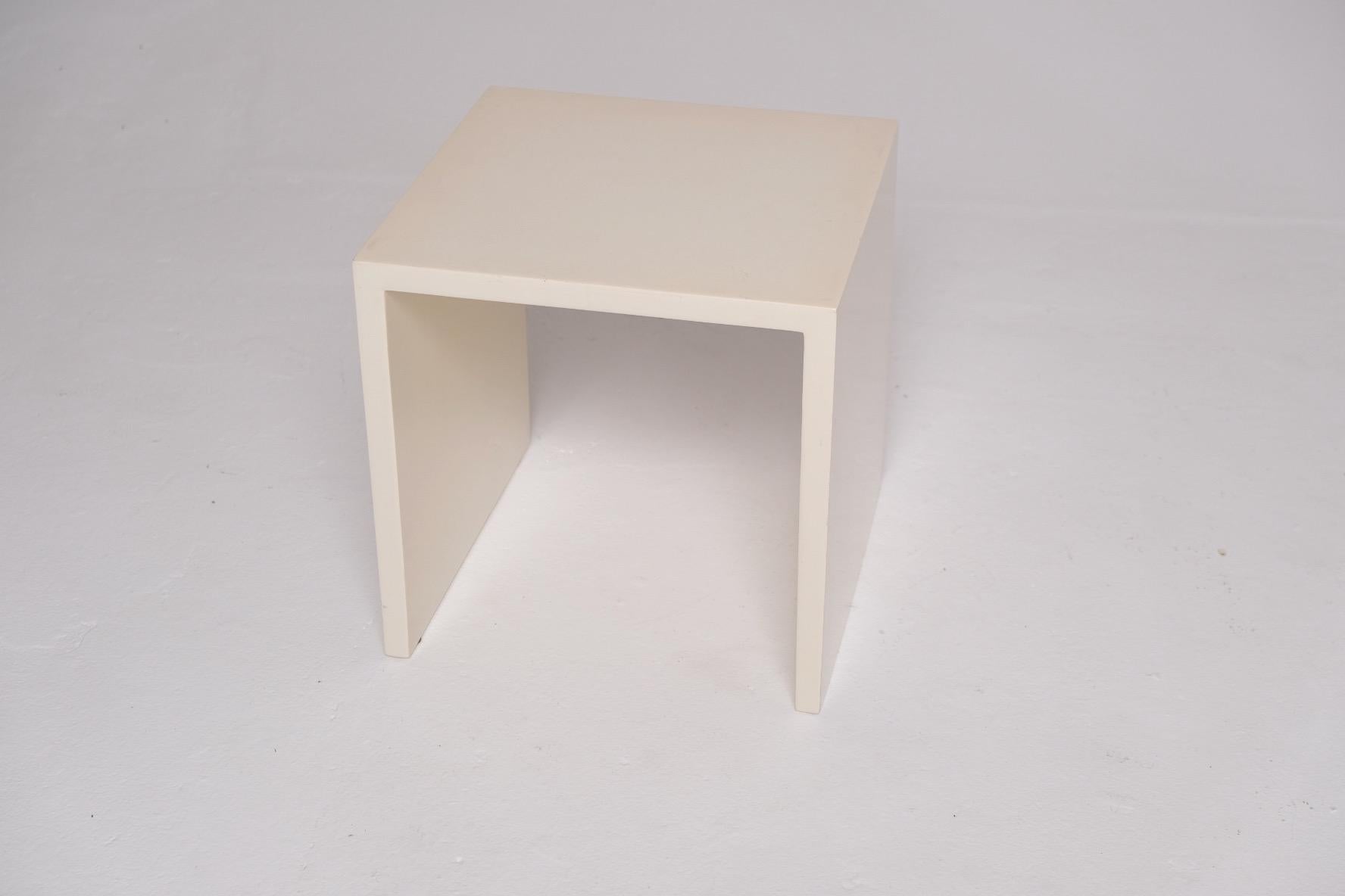 A minimalist design icon by New York-based Property Furniture, the Saddle Side Table is a study in precision and quiet impact. Measuring 15 x 15 x 15 inches, its clean-lined cube form is executed in a high-gloss lacquer finish that adds a sense of
