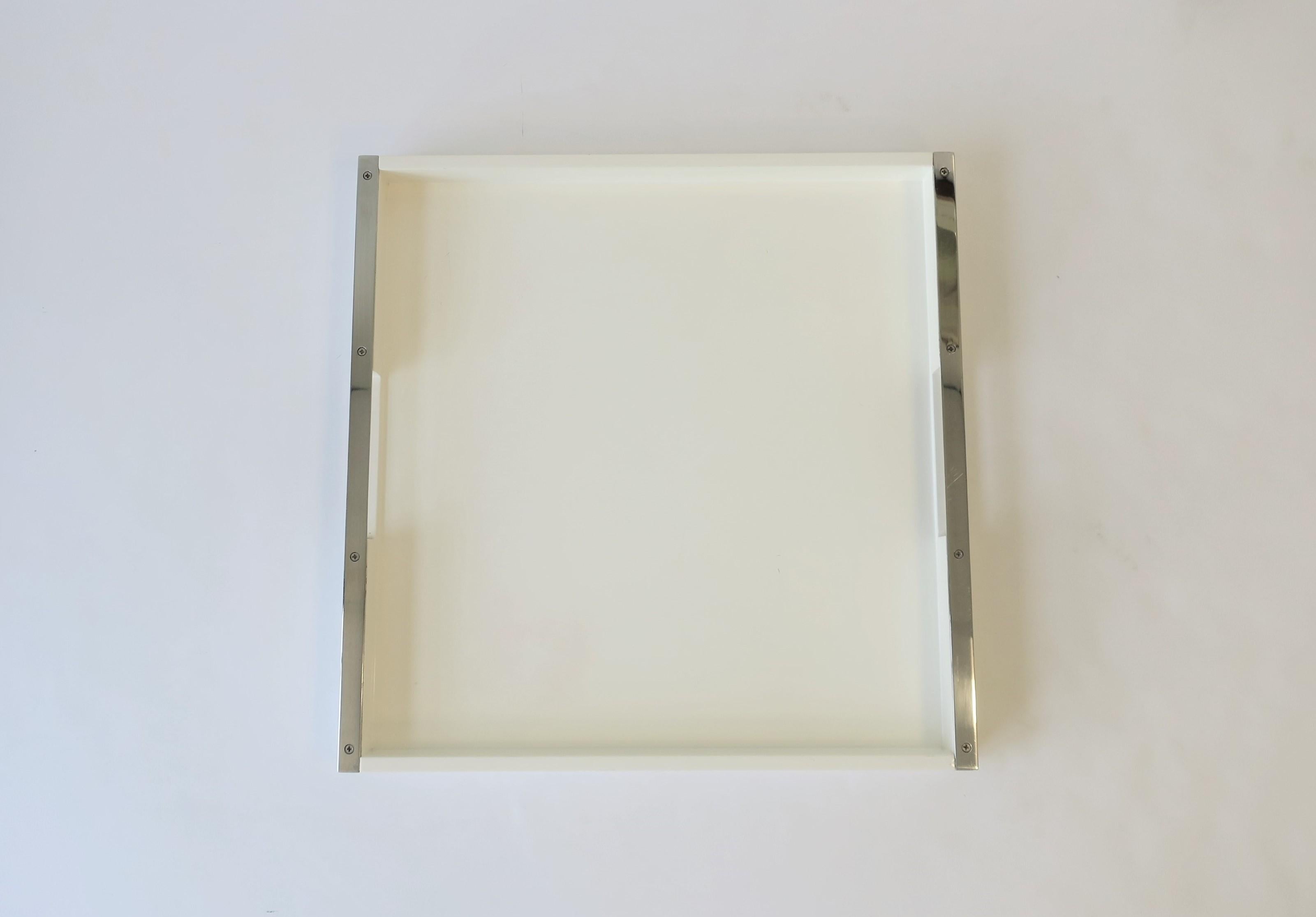 A square white lacquer serving tray with chrome handles in a Modern or Minimalist style.

Tray measures: 1.75