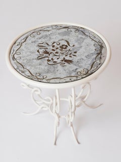 Gueridon en fer forgé laqué blanc et verre églomisé att. René Drouet - France