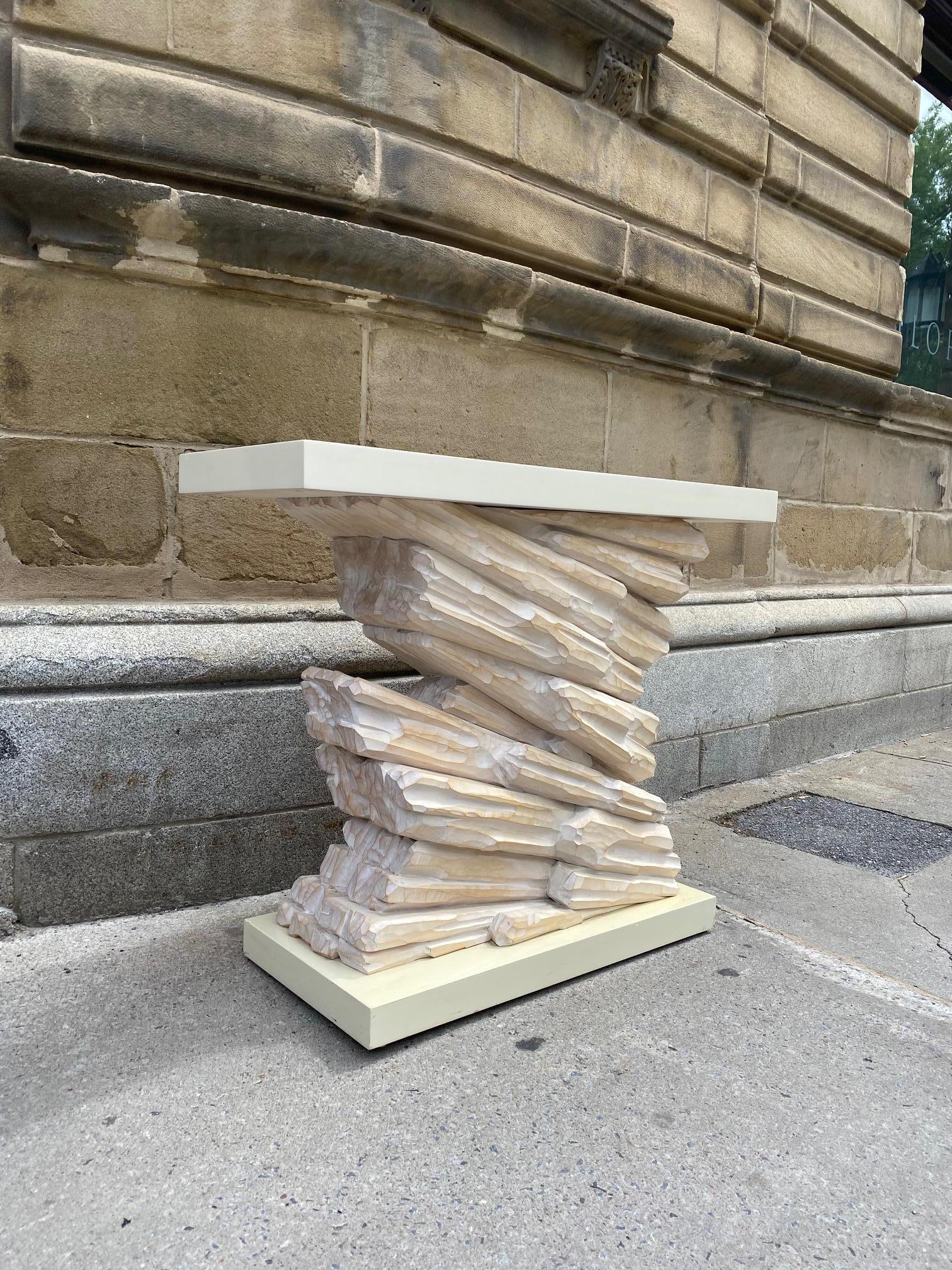 White lacquered and carved wood console table in the manner of Serge Roche, the rock form base cared out of a solid block of maple finished with a white wash, the top and base made of lacquered wood. 