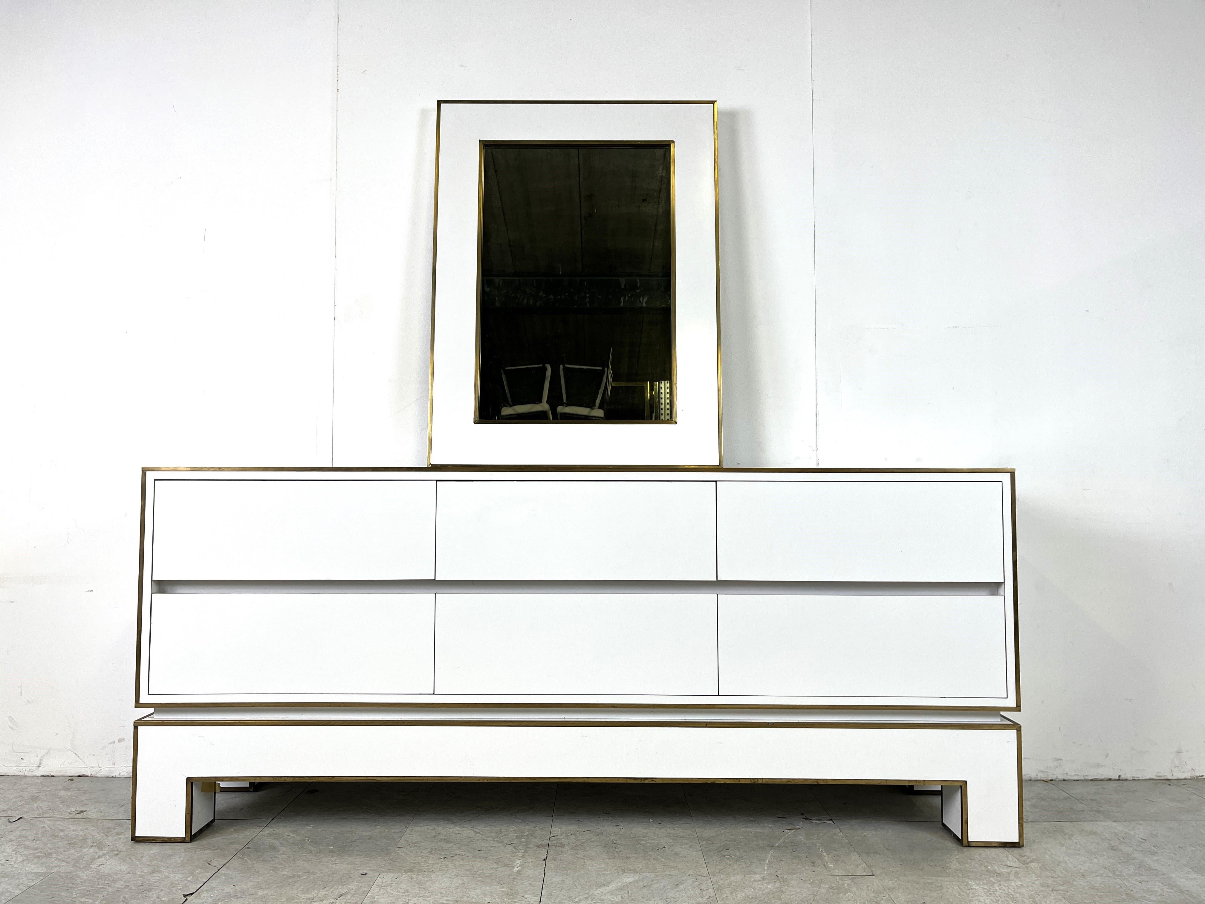Mid century 6 drawer credenza by Alain Delon in white lacquer and brass.

This exquisite credenza is pure quality, with a combination of good materials and the right patina it is a great add-on for any room.

Comes with very rare matching