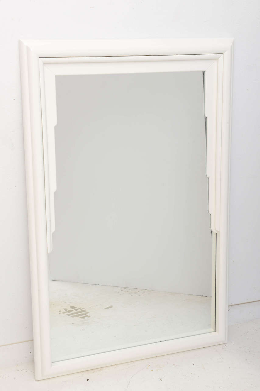 This stylish Art Deco influenced mirror with its white lacquered finish will make the perfect addition to your home for a bit of clean lined glamour with its draped fabric folds. 

 