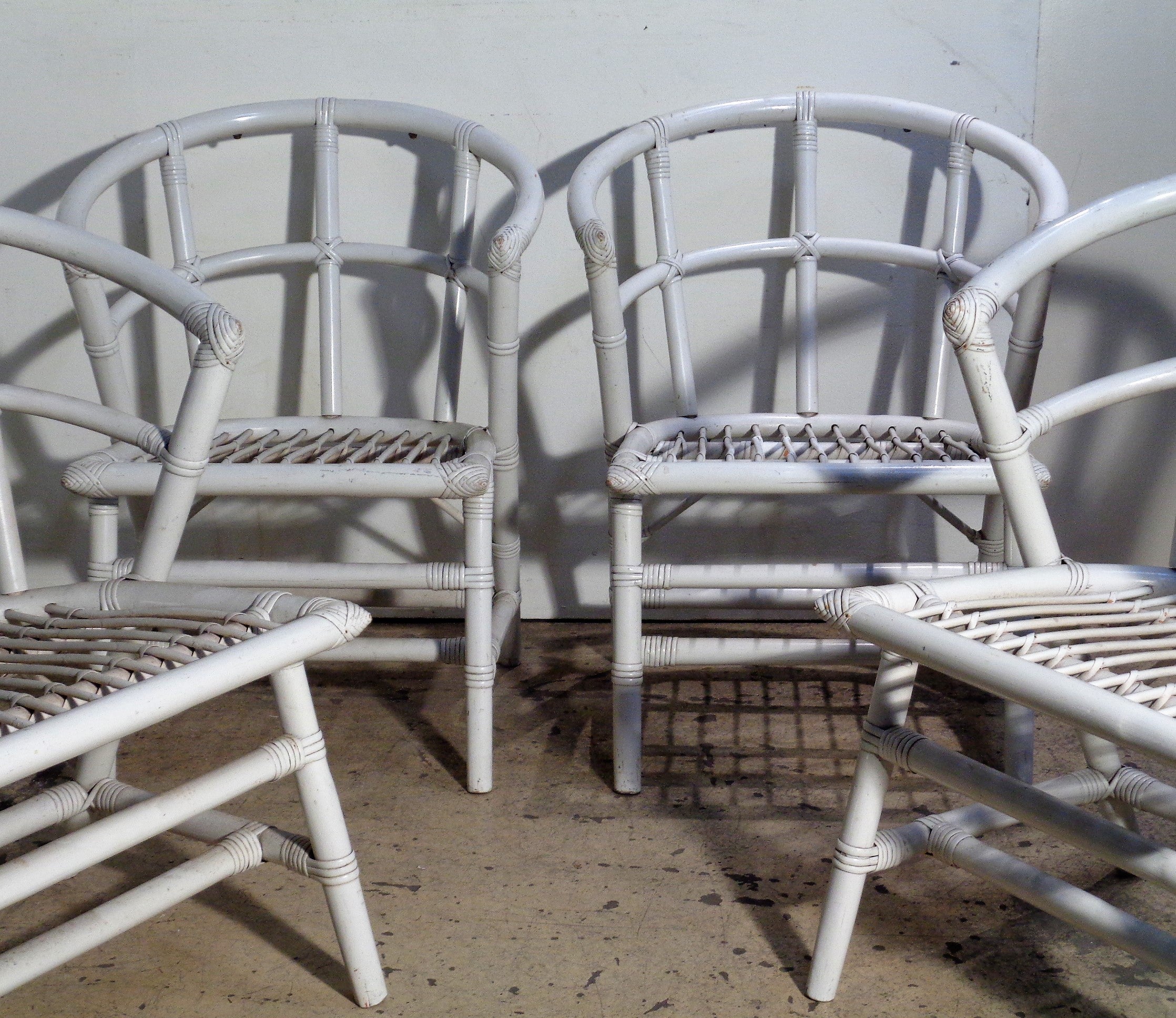 Set of four armchairs by Willow and Reed in nicely aged old gloss white lacquered surface. Attributed to Tommi Parzinger, circa 1940-1950. Measure 30