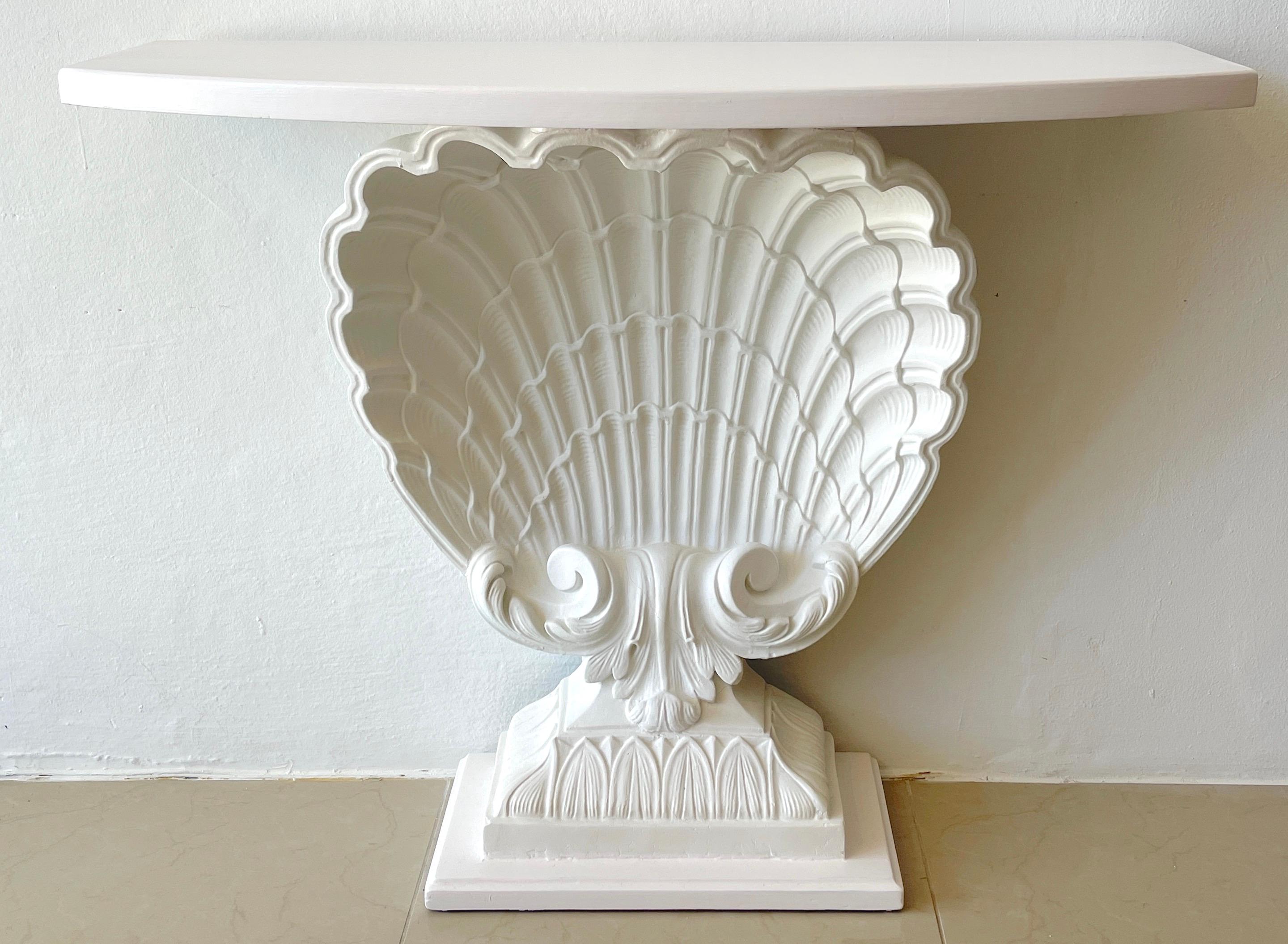 White Lacquered shell console by Grosfeld House, restored
A fine period example with high relief carving, newly lacquered. 
Console measures 38