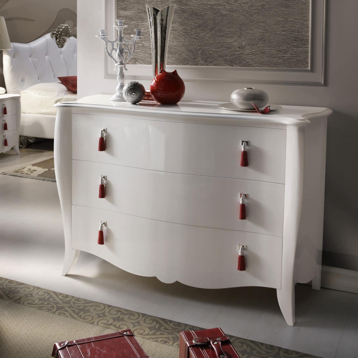 Discover this white dresser in lacquered wood with three drawers by Ros Italia Interiors. The handles are in leather and metal with a silver finishing. Please, contact the Concierge service for further information.