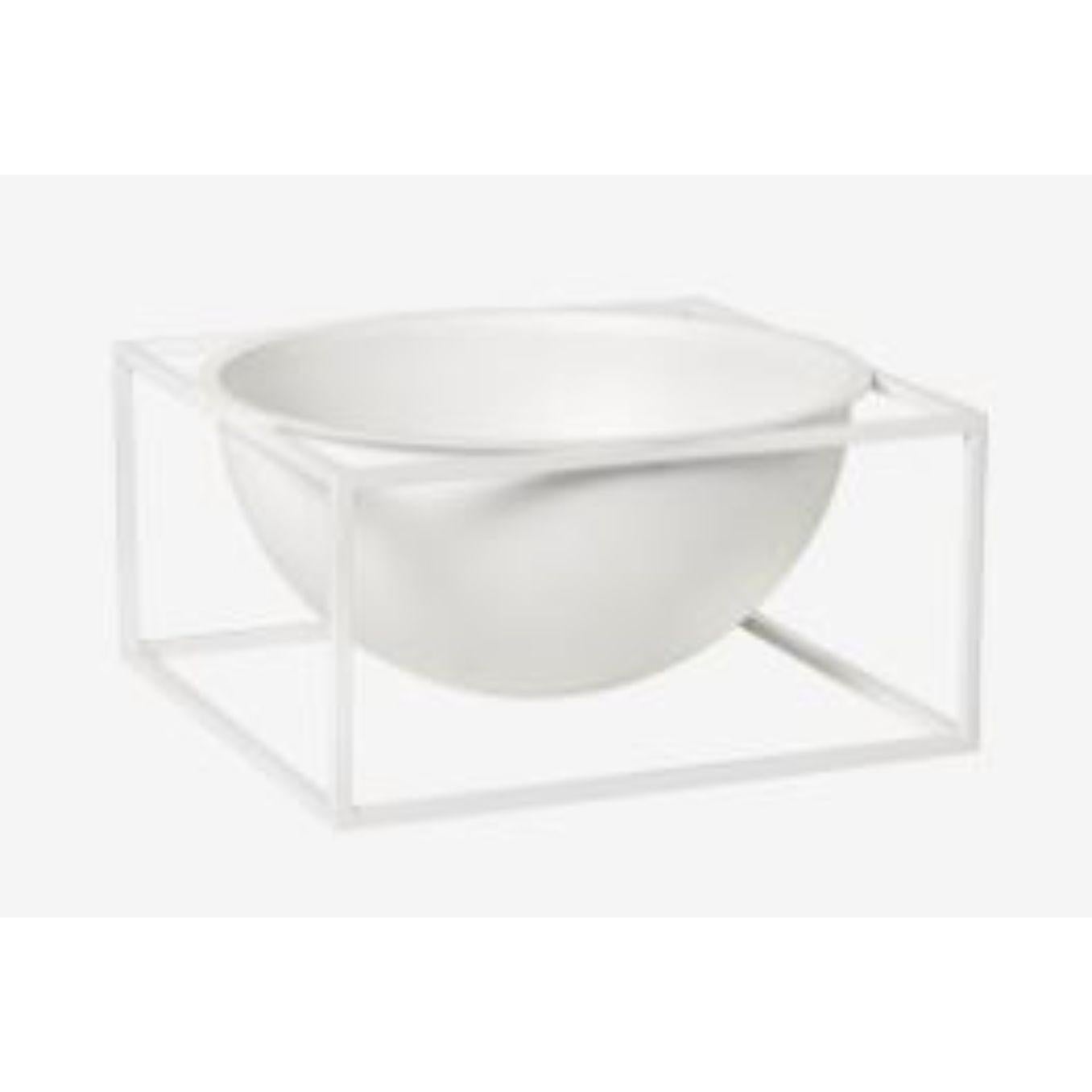 White large centerpiece Kubus bowl by Lassen
Dimensions: d 23 x w 23 x h 11.50 cm 
Materials: Metal 
Weight: 3 Kg

The dictionary definition is “an object occupying a central, especially an adornment in the center of a table” and the Kubus