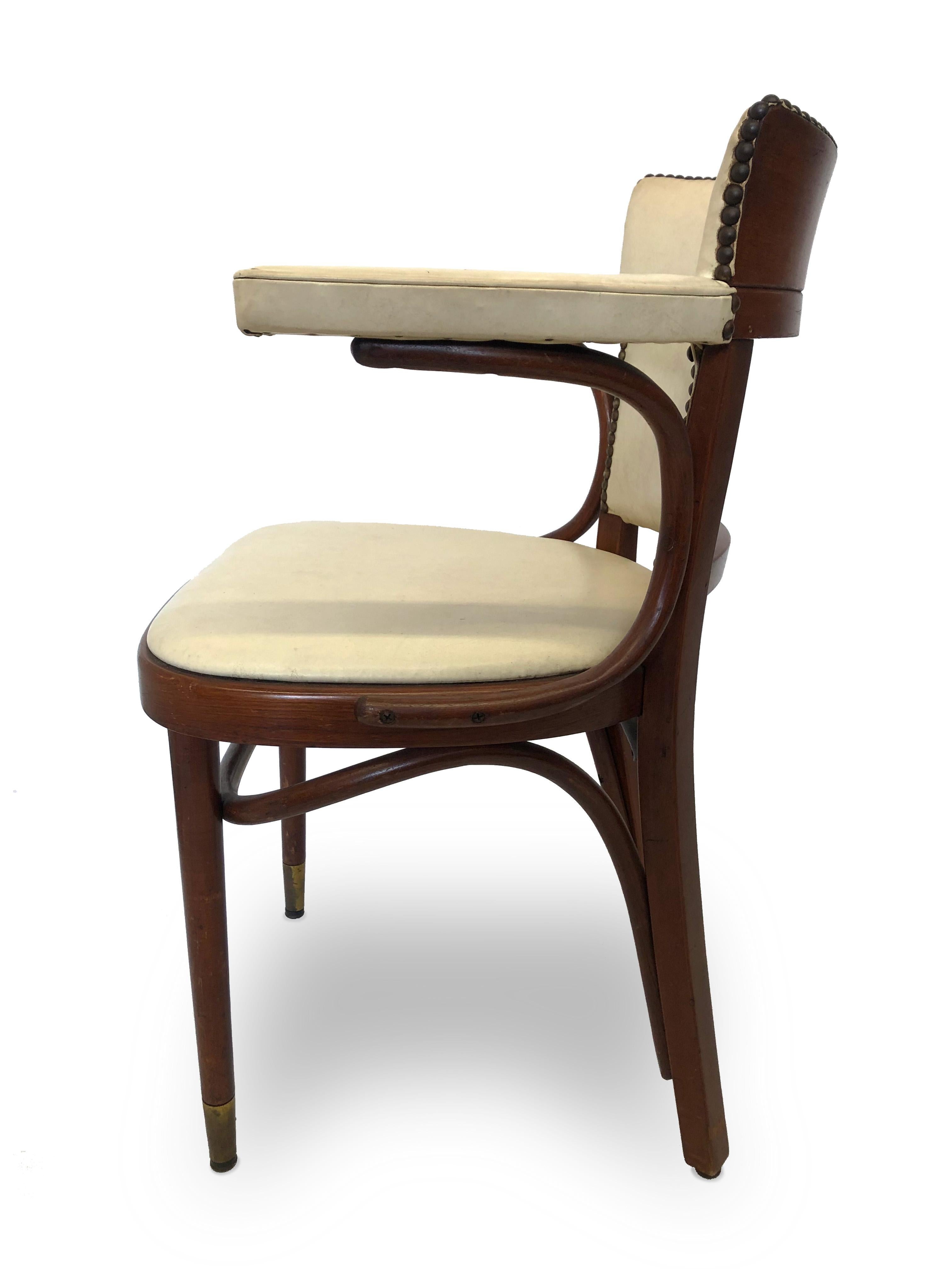 This wooden chair is exquisitely adorned with nail heads through out the squared back of the chair. The chair has a curved support that elegantly holds the arm rest, along with its straight wooden legs and beautiful white leather seat. 

Property
