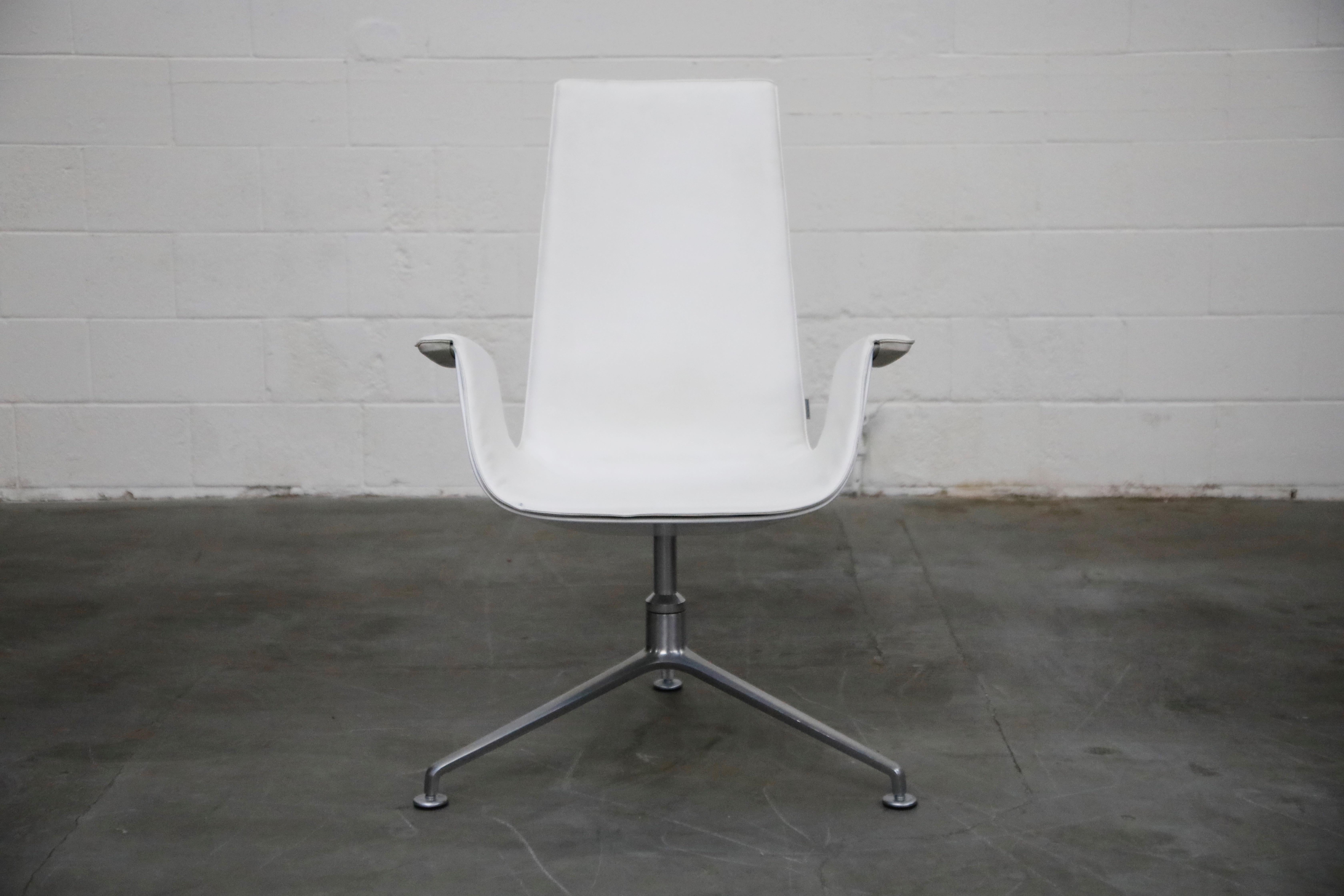 High-back swivel example of the extremely popular-amongst-designers and collectors, white leather 'Bird' chair model # FK-6727, also commonly referred to as the 'Tulip' bucket chair, designed by Preben Fabricius and Jørgen Kastholm, manufactured in