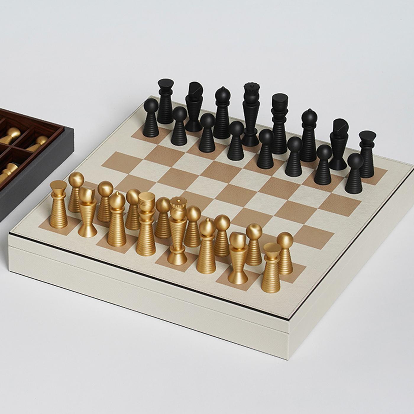 Dynamic and elegant, this chess board set will make a sublime accent in a modern or traditional home. Crafted of walnut, the box is upholstered in white leather and accented with gold board squares for the chessboard surface, while the interior