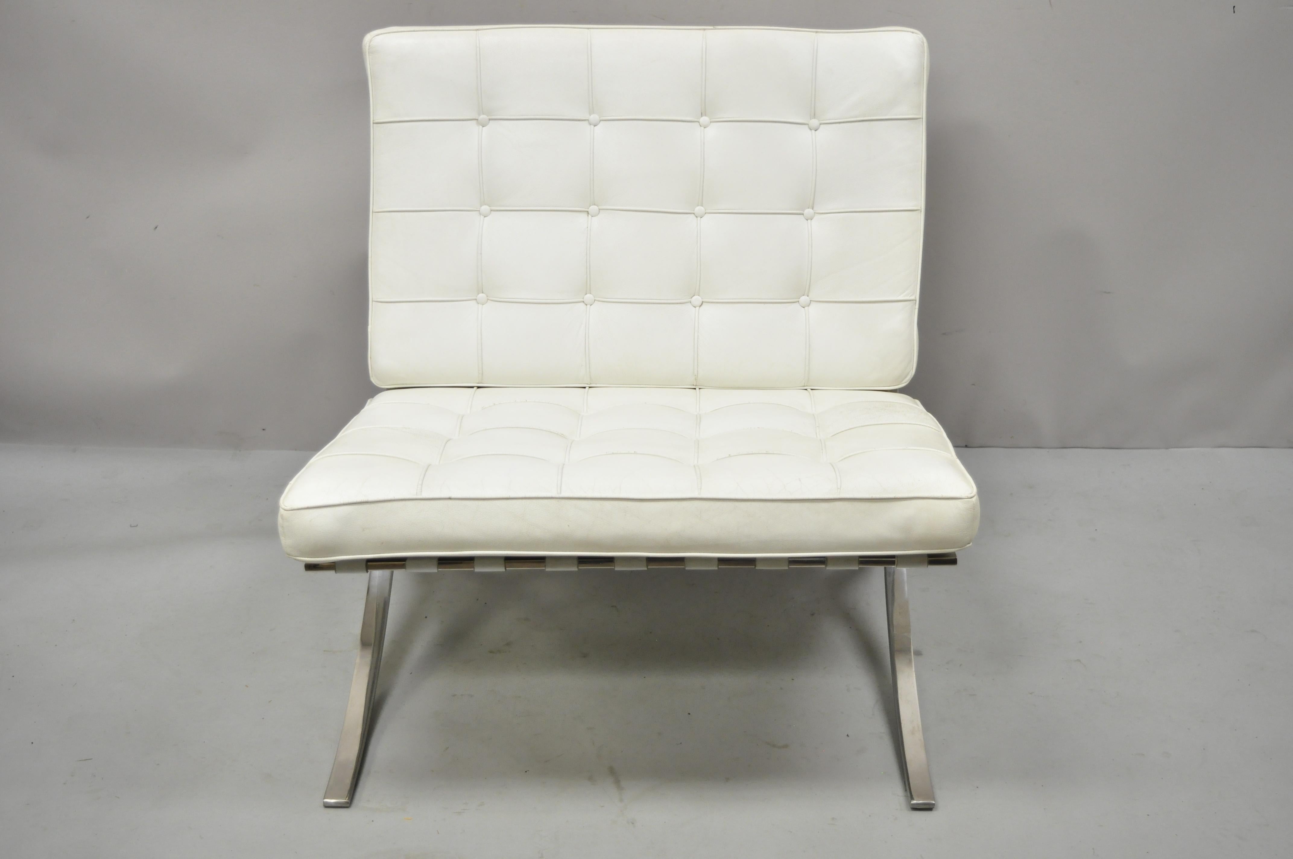 White leather Ludwig Mies van der Rohe Barcelona style chrome steel lounge chair, vintage reproduction. Item features white leather button tufted cushions white leather straps, heavy polished steel frame, great style and form. Late 20th century,