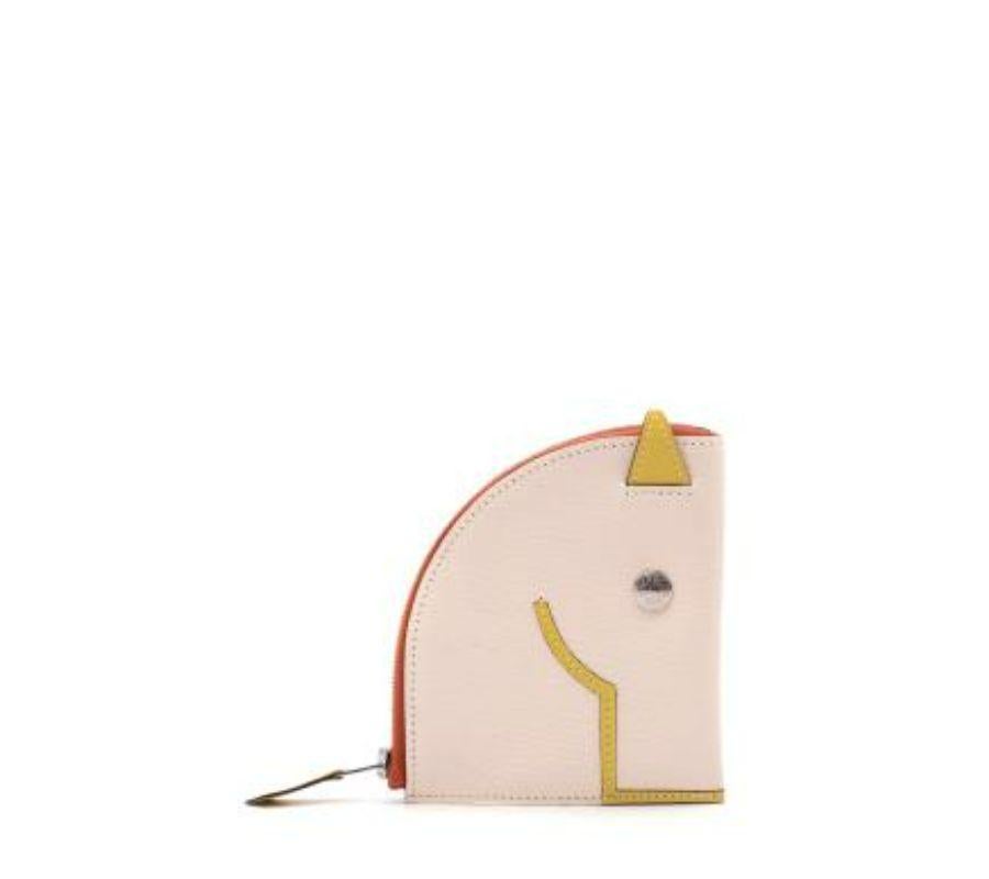 The Hermes Paddock Change Purse is inspired by the house’s iconic animal, the horse.
 
 Designed with a round curved shape that represents its neck. The top features its ears while the Clou de Selle snap detailing represents its eyes.
 
 This wallet