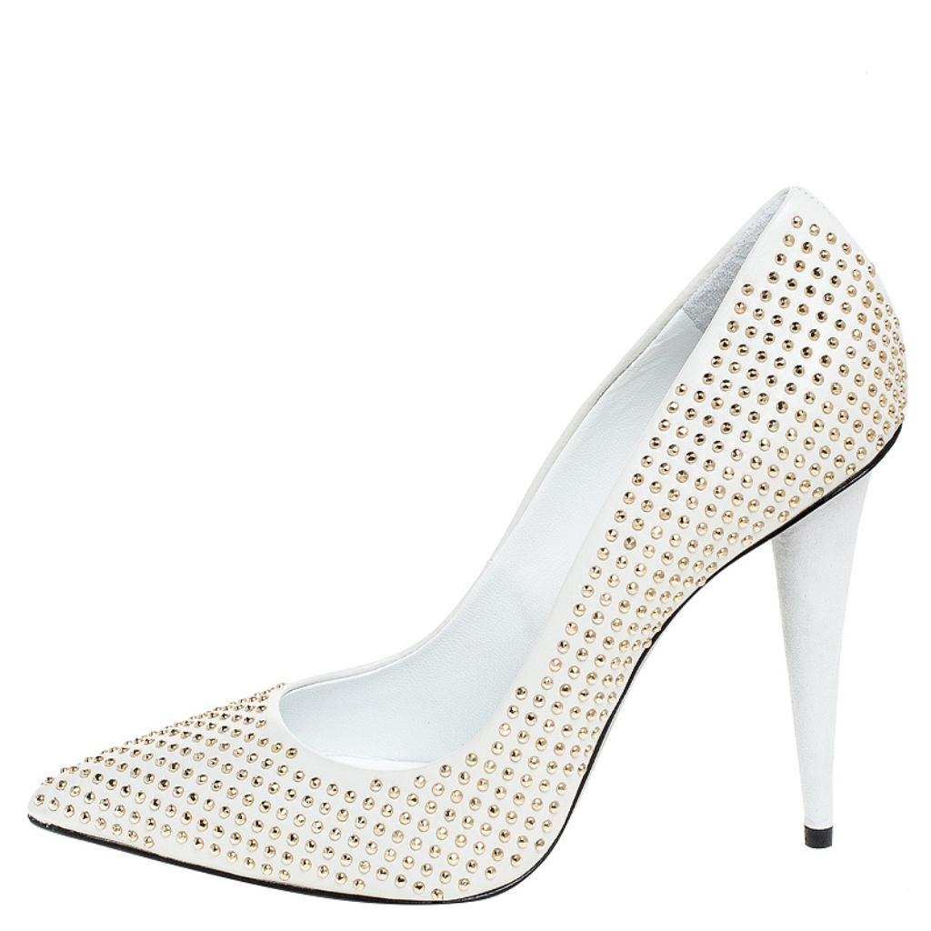 Revamp your footwear collection by adding this pair of shimmering Giuseppe Zanotti pumps to your wardrobe. The white pumps are crafted from leather and feature exquisite stud embellishments adorning the exterior. Pointed toes, comfortable