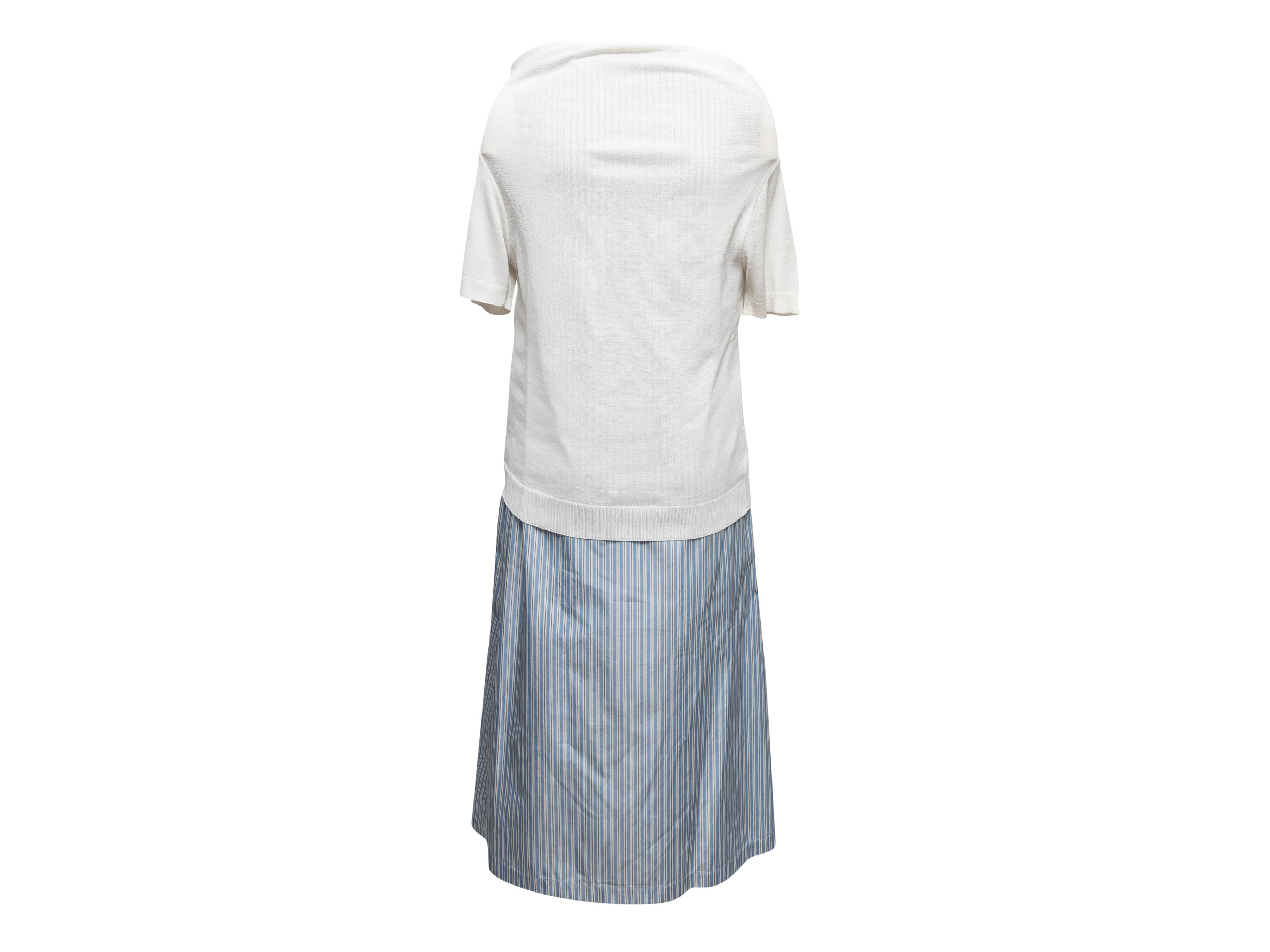 White and light blue pinstriped layered dress by Tricot Comme Des Garcons. Bateau neckline. Short sleeves. Button closures at front. 35