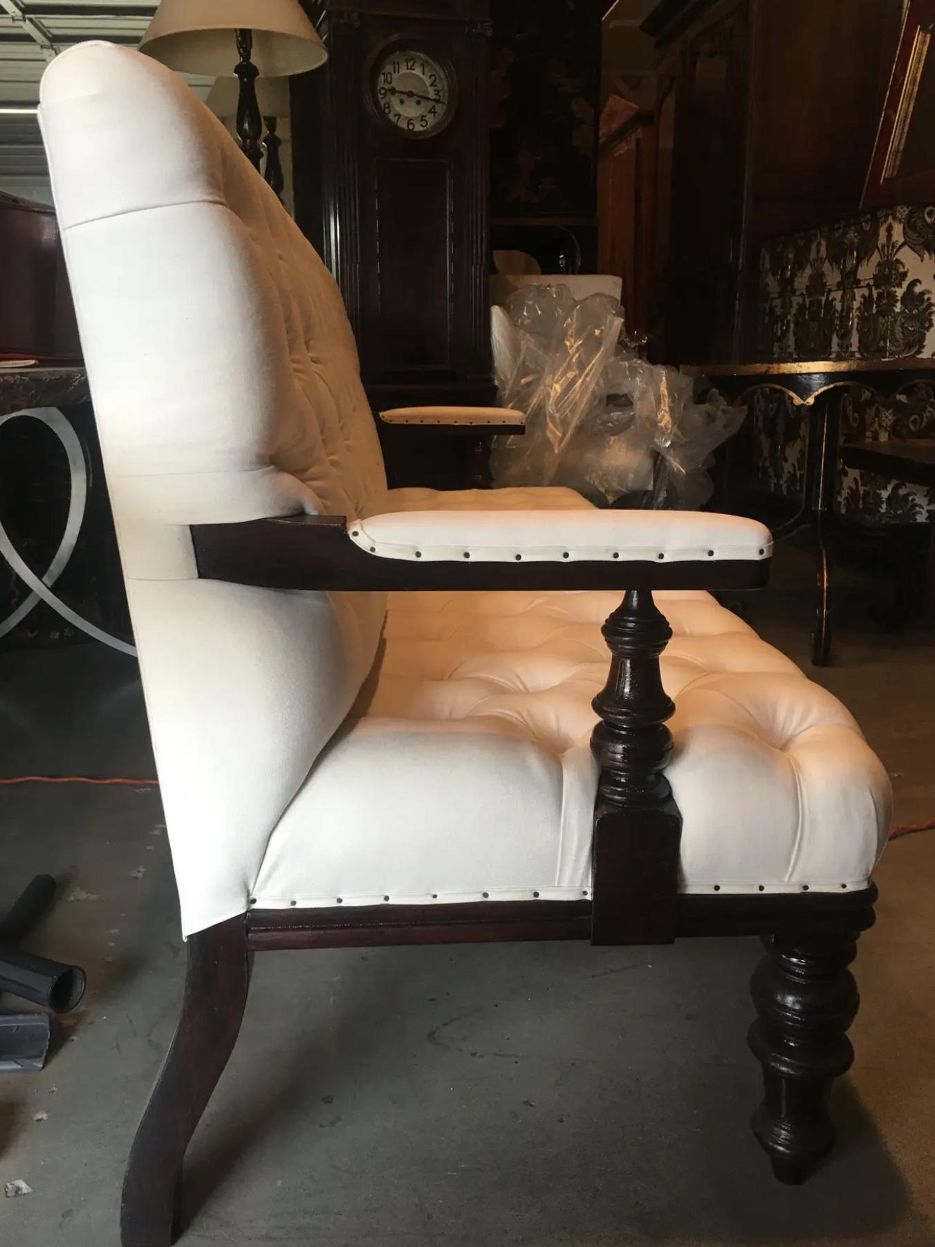 Button-back Chesterfield in the style 1860-1880s. Heavy white linen makes it an easy addition to a modern interior designed room. Solid mahogany frame to withstand the years and tightly wrapped on corners, padded wood arms and small brads around.