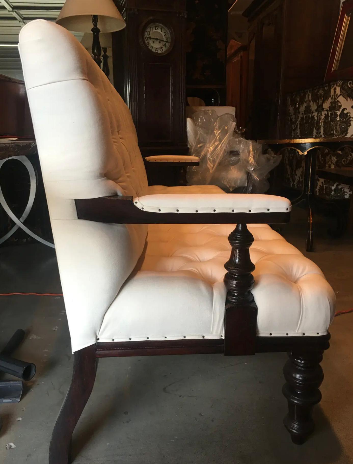 Button-back Chesterfield in the style 1860-1880s. Heavy white linen makes it an easy addition to a modern interior designed room. Solid mahogany frame to withstand the years and tightly wrapped on corners, padded wood arms and small brads around.