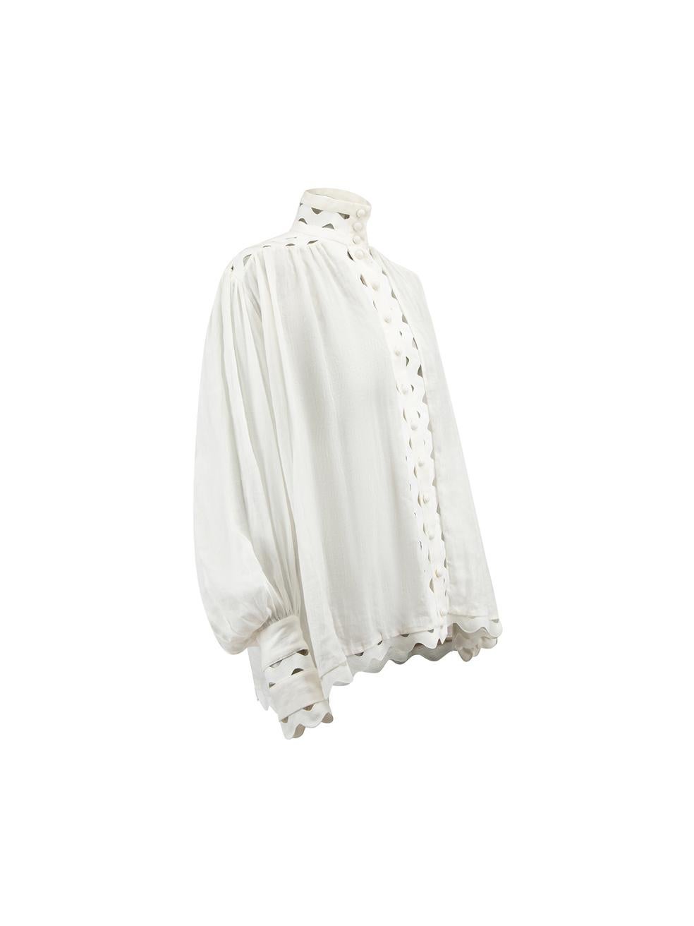 CONDITION is Never worn, with tags. No visible wear to shirt is evident on this new Zimmermann designer resale item. 



Details


White

Ramie

See-through

Long-sleeved blouse

Loose-fitting

Wave trim cutout details

Mock neck

Button-up