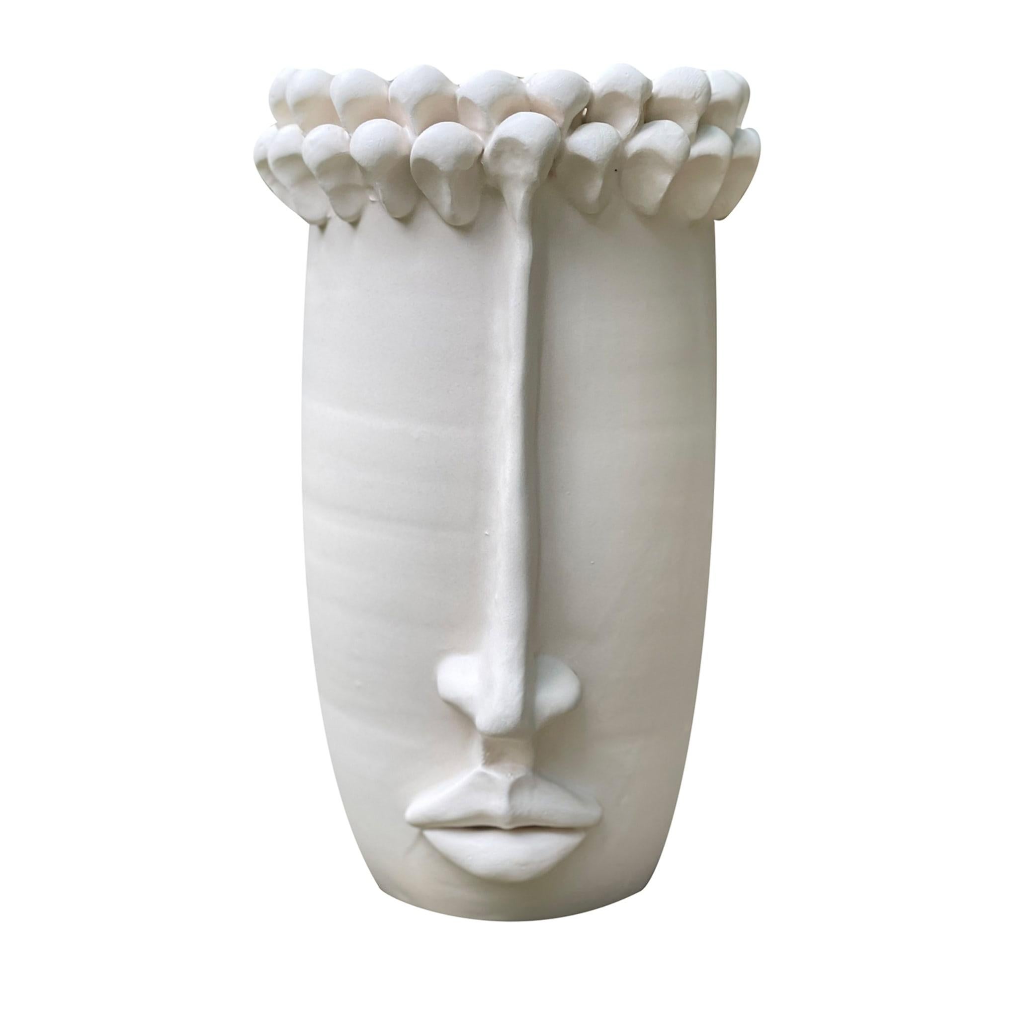 A decorative vase for the home, that can contain water and flowers. The pinecones above the head are an element that characterizes the Sicilian culture: a symbol of hospitality and good wishes.