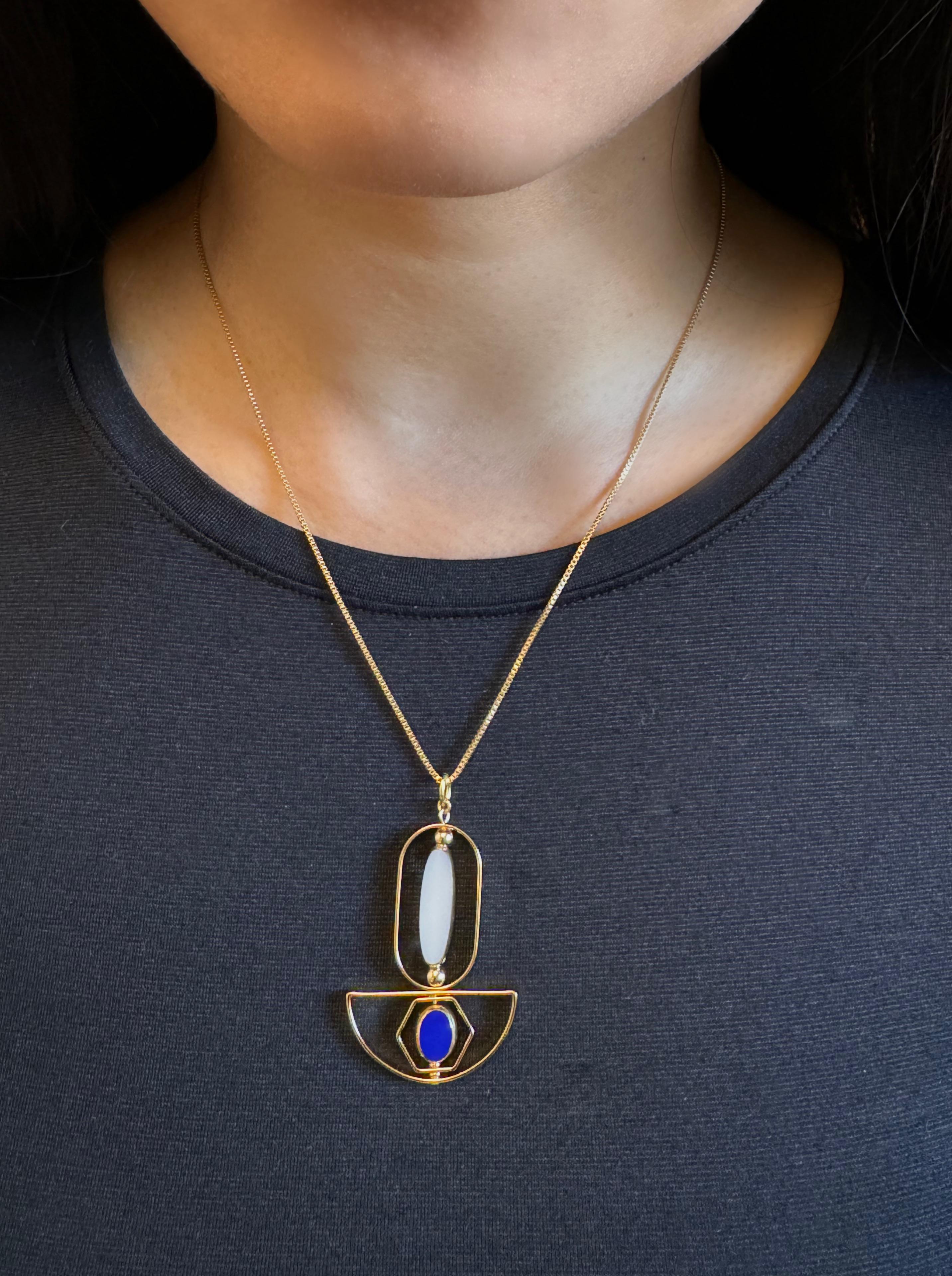 The pendant consist of white long oval and small blue oval new old stock vintage German glass beads that are framed with 24K gold. The beads were hand-pressed during the 1920s-1960s. No two beads are exactly alike. These beads are no longer in