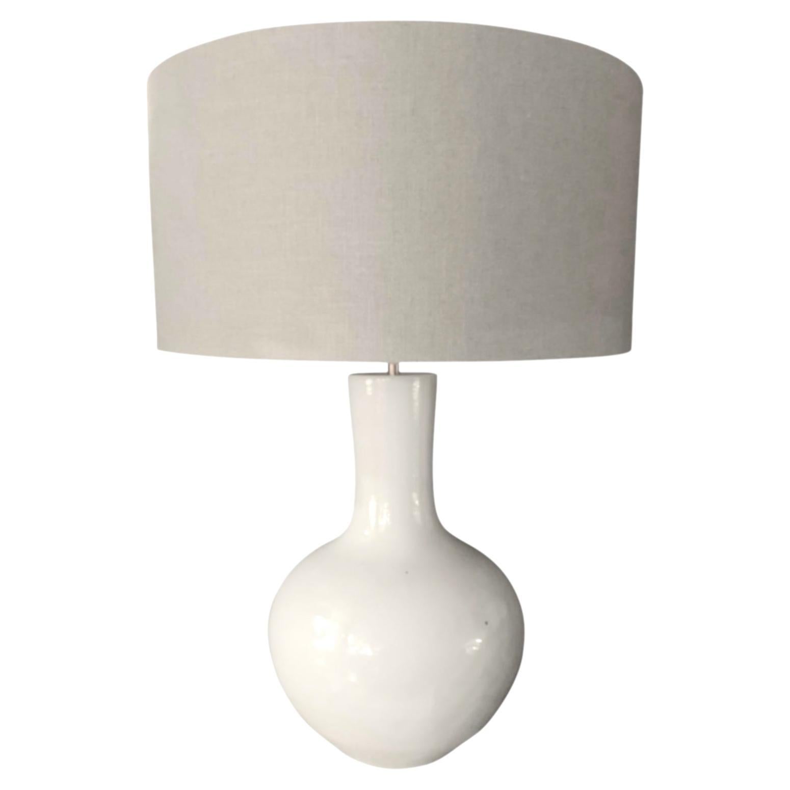 Contemporary Chinese white long tube length neck pair of lamps with rounded base.
Base measures 9.5