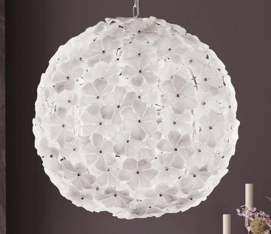 Italian chandelier with layered hand blown white Murano lotus flowers mounted chrome spherical structure / Made in Italy in the style of Cenedese
Measures: diameter 31.5 inches, height 31.5 inches plus chain and canopy
12 lights / E26 or E27 type /