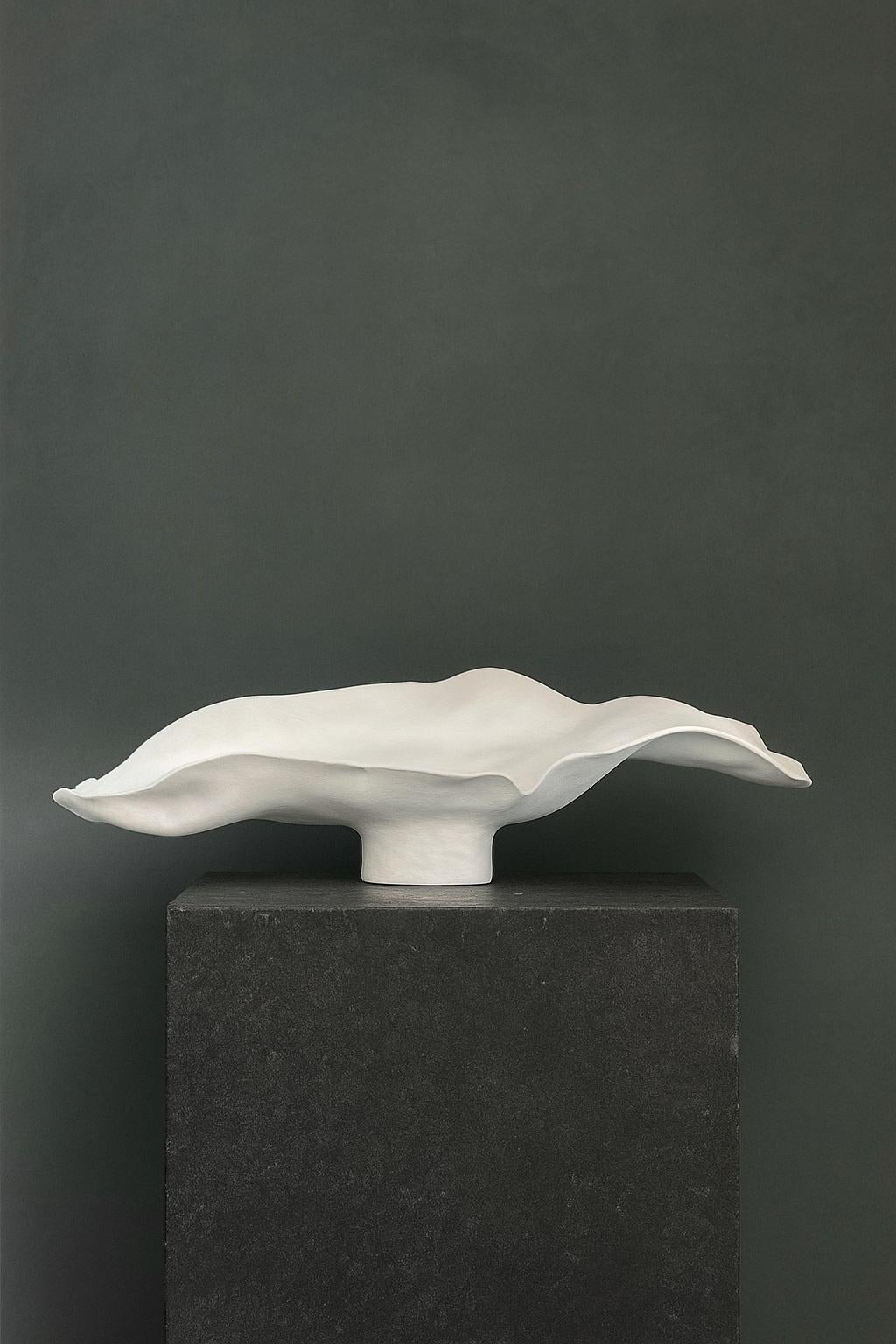 The White Lotus Vase by Maison Lamiè is striking in both proportion and restraint. Measuring 20 inches wide and 5.5 inches high, its broad, low form captures the eye with an elegant stillness that feels both ancient and modern. Sculpted by hand