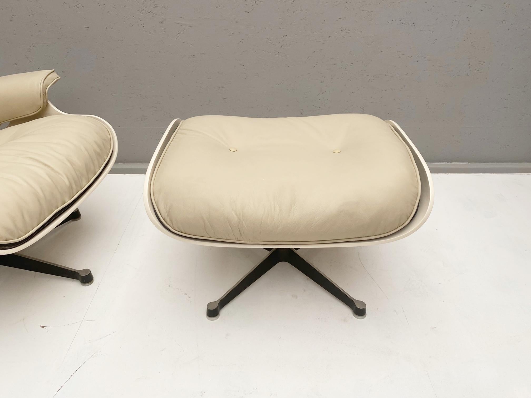 White lounge chair and ottoman in style of Charles and Ray Eames- A pair available.