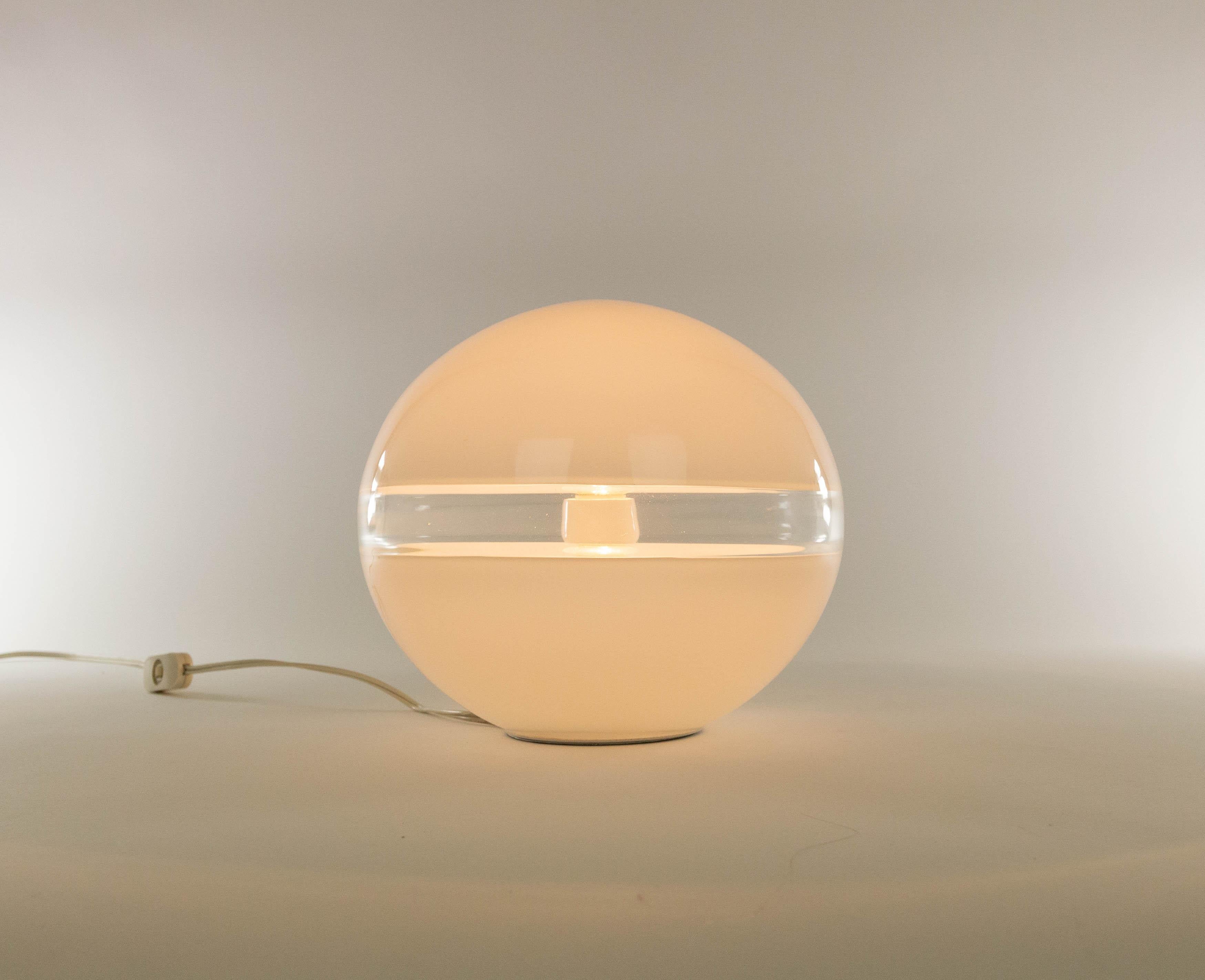 White LT 230 table lamp designed by Carlo Nason and manufactured in the 1960s by Murano glassmaker A.V. Mazzega. The lamp is made of white Murano glass and has a transparant crystal band.

This model was produced in two sizes; this is the smaller