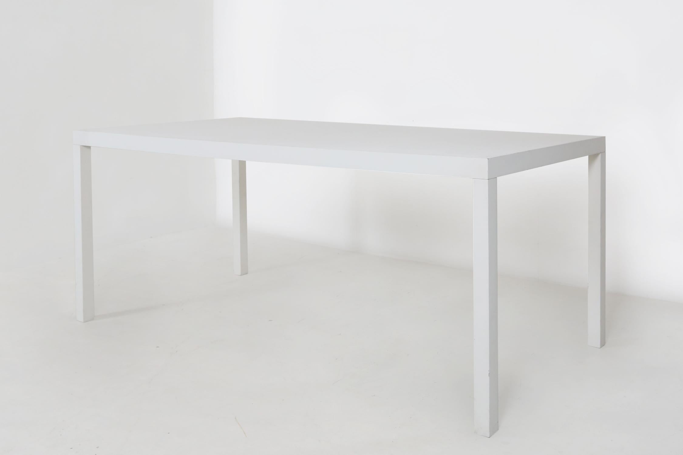White T88W table by designer Maarten Van Severen.
This table is a Top Mouton edition.

The chair is not for sale, it is just for scale.
