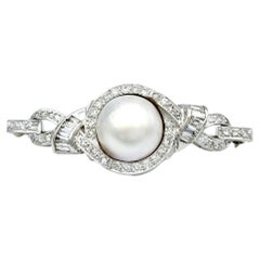 White Mabe Pearl and Diamond Ribbon Style Platinum Brooch with Milgrain Detail