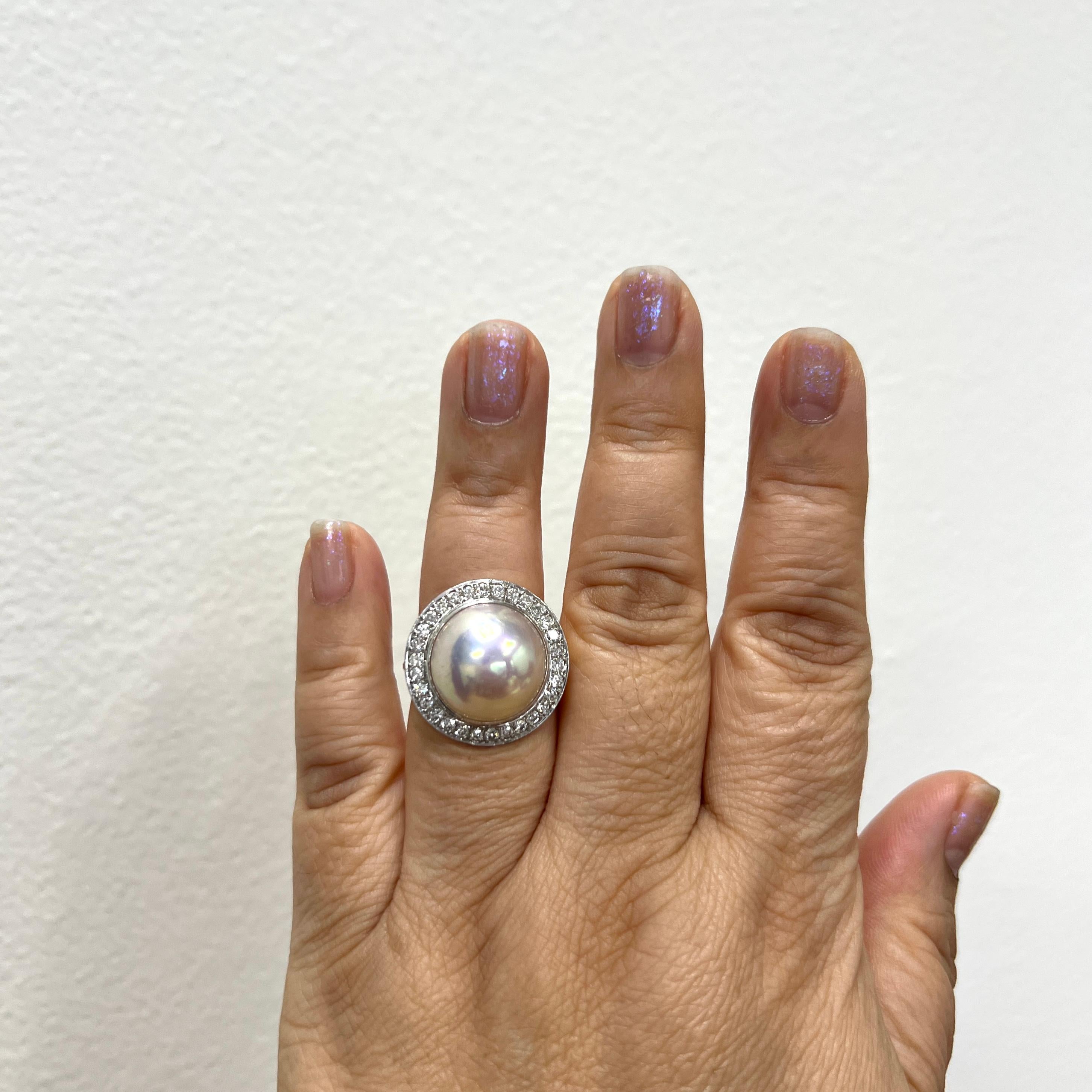 Gorgeous big white mabe pearl with good quality, white, and bright diamond rounds (total 30 stones).  Handmade in 18k yellow gold and platinum.  Ring size 7.25.