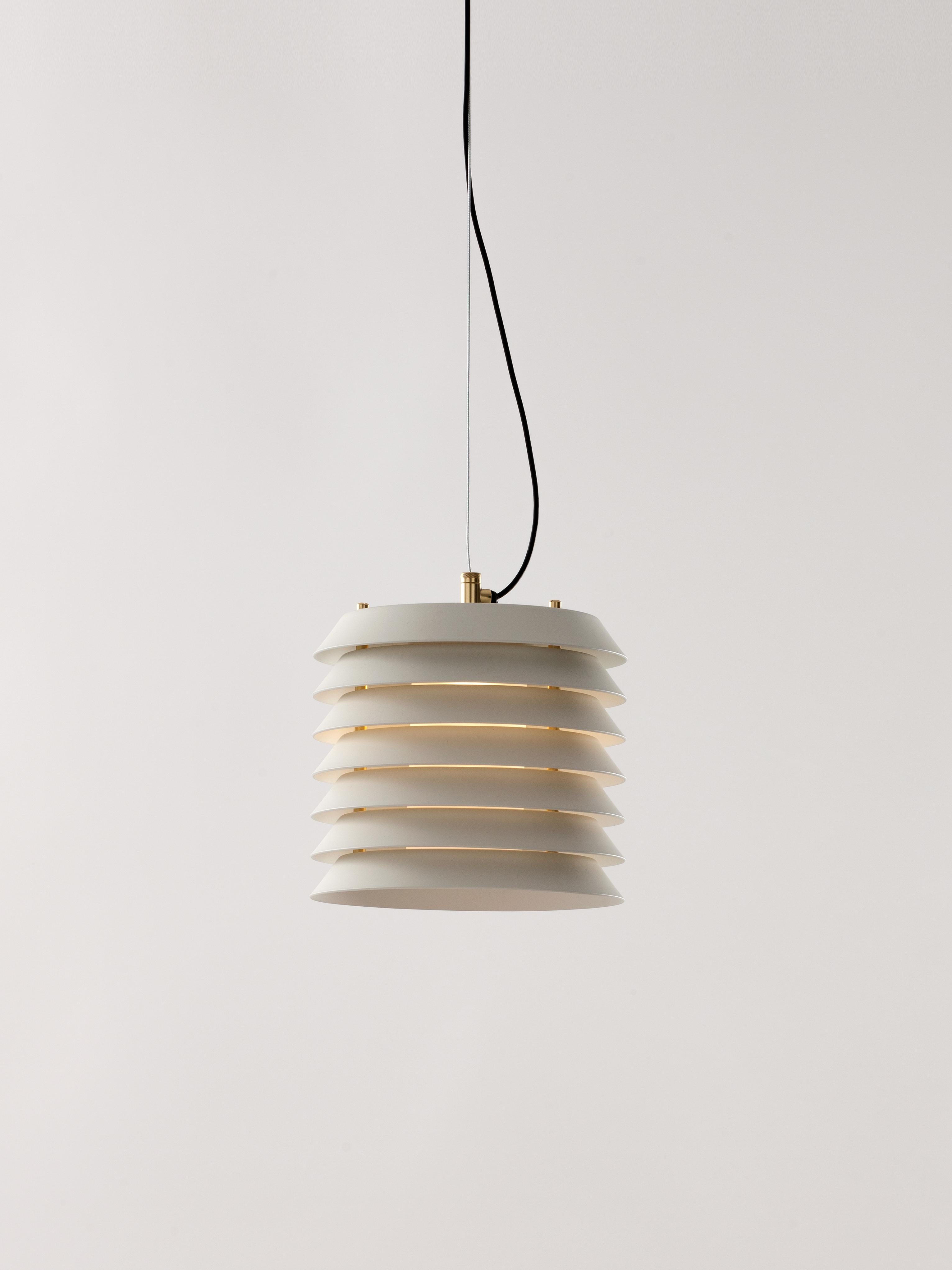 White Maija 15 Pendant Lamp by Ilmari Tapiovaara.
Dimensions: D 15 x H 14 cm.
Materials: Metal, glass.
Available in white or nude rose.

Maija conveys the feeling of light typical of Baltic cities, where the streets are barely illuminated,