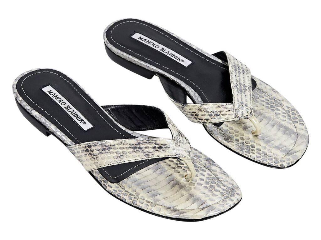 Product details:  White snakeskin thong sandals by Manolo Blahnik.  Slip-on style.  Label size IT 36.5
Condition: Pre-owned. Very good. 
Est. Retail $ 695.00
