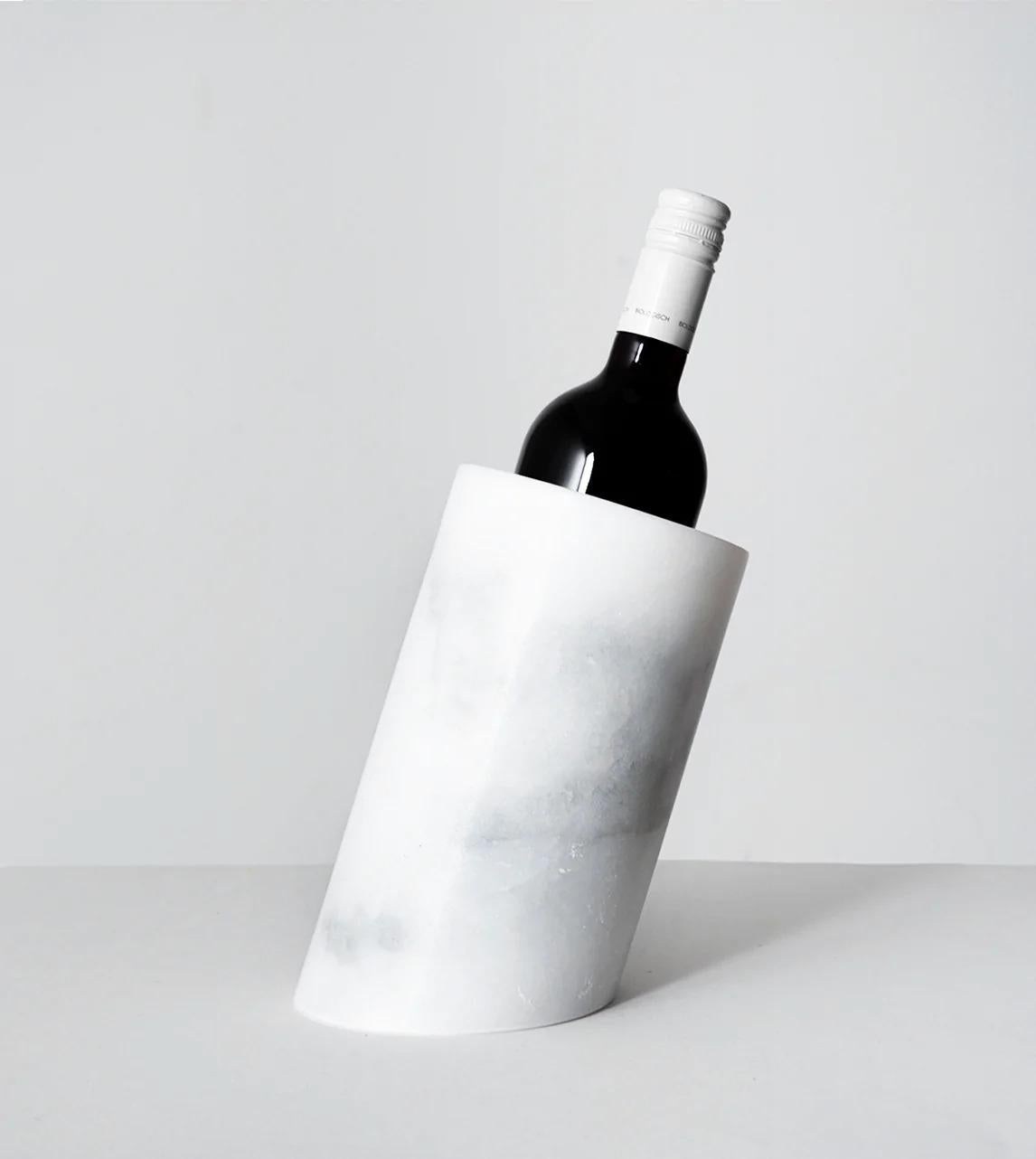 This white marble angled wine cooler is designed by us and hand crafted by the artisans within the fair-trade principles.

The natural properties of marble will keep your wine chilled with no need for ice - you can also place this marble cooler in