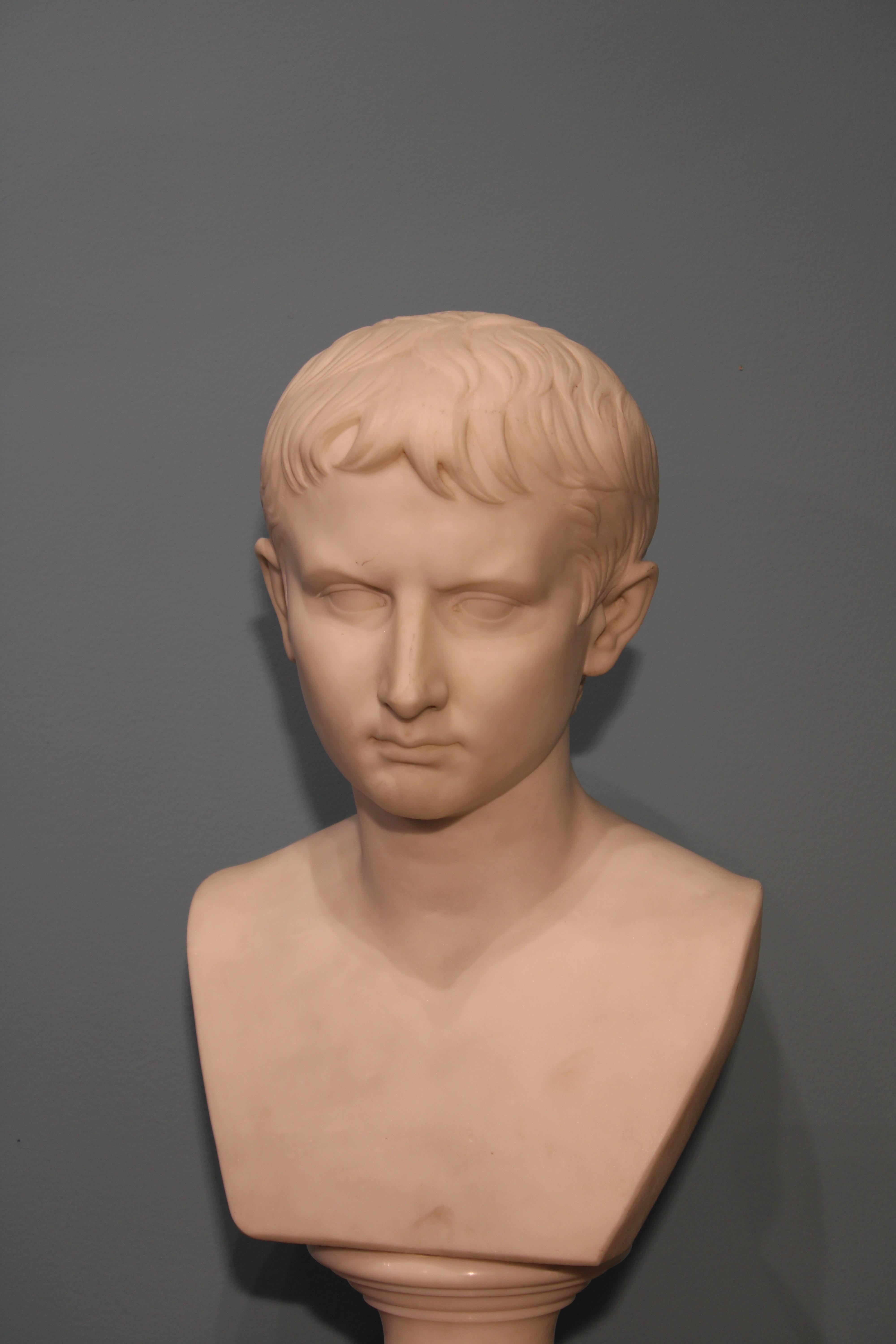 White carved marble.
Presumed portrait of Emperor Augustus on scabellon.