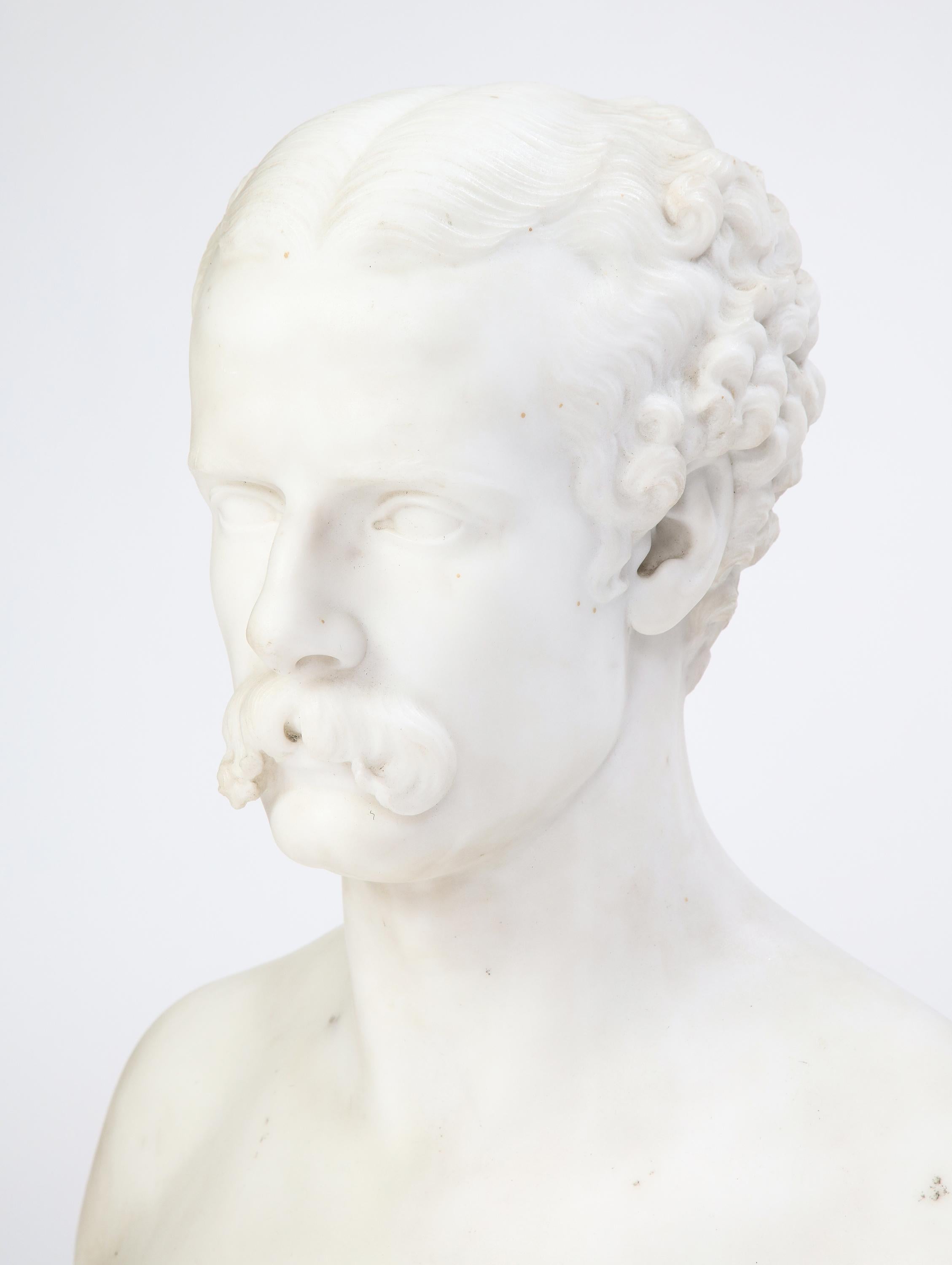 This work, a Baroque style carved white marble bust of a man with Classical features raised on a decorative turned plinth, is an excellent example of an artwork probably carved in Italy during the explosion of decorative sculpture in the 19th and