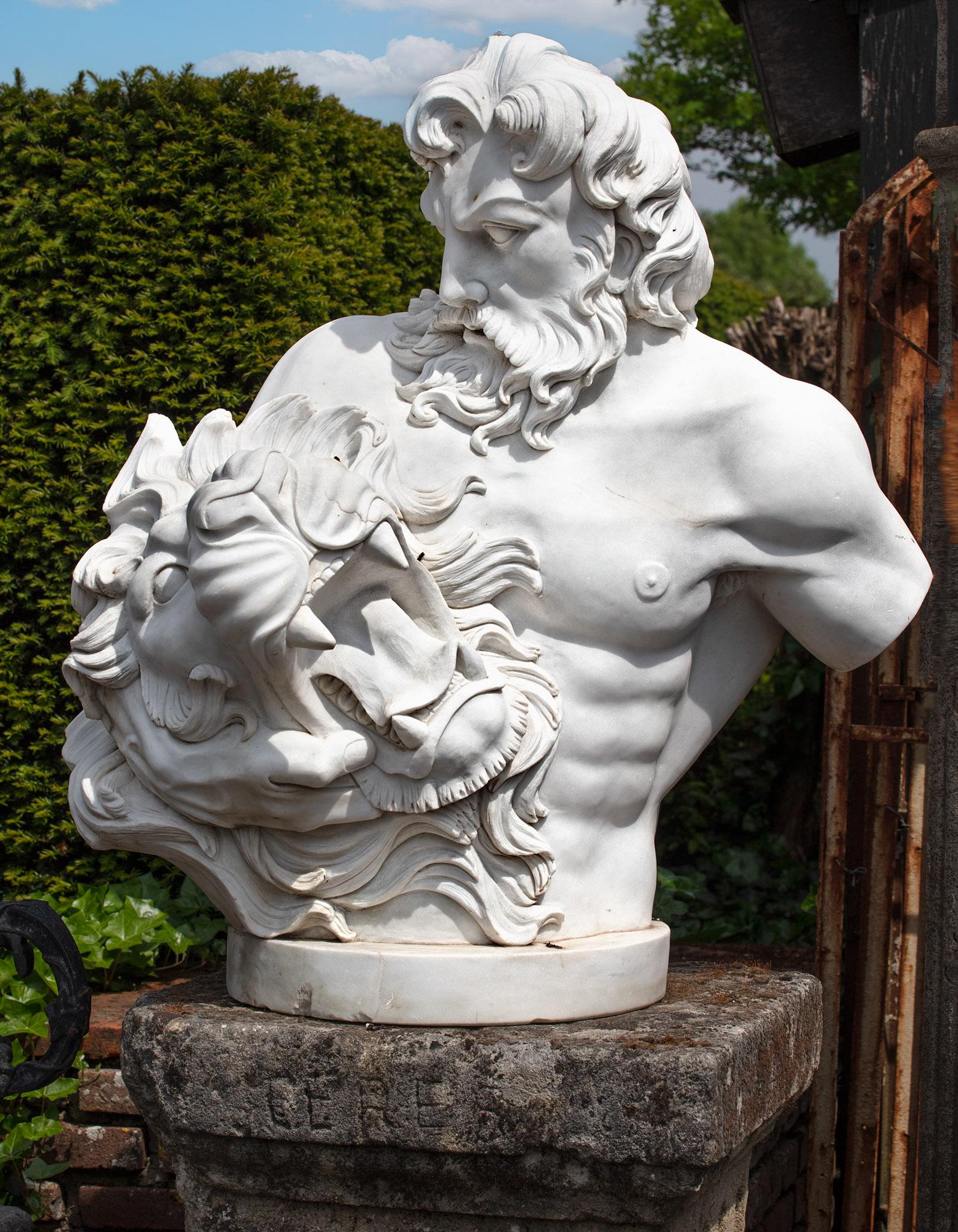This impressive white marble bust depicts the mythical figure of Hercules, shown holding the head of the Nemean Lion. A powerful example of sculptural art, dating from the late 20th century. Truncated by design, Hercules is portrayed here holding