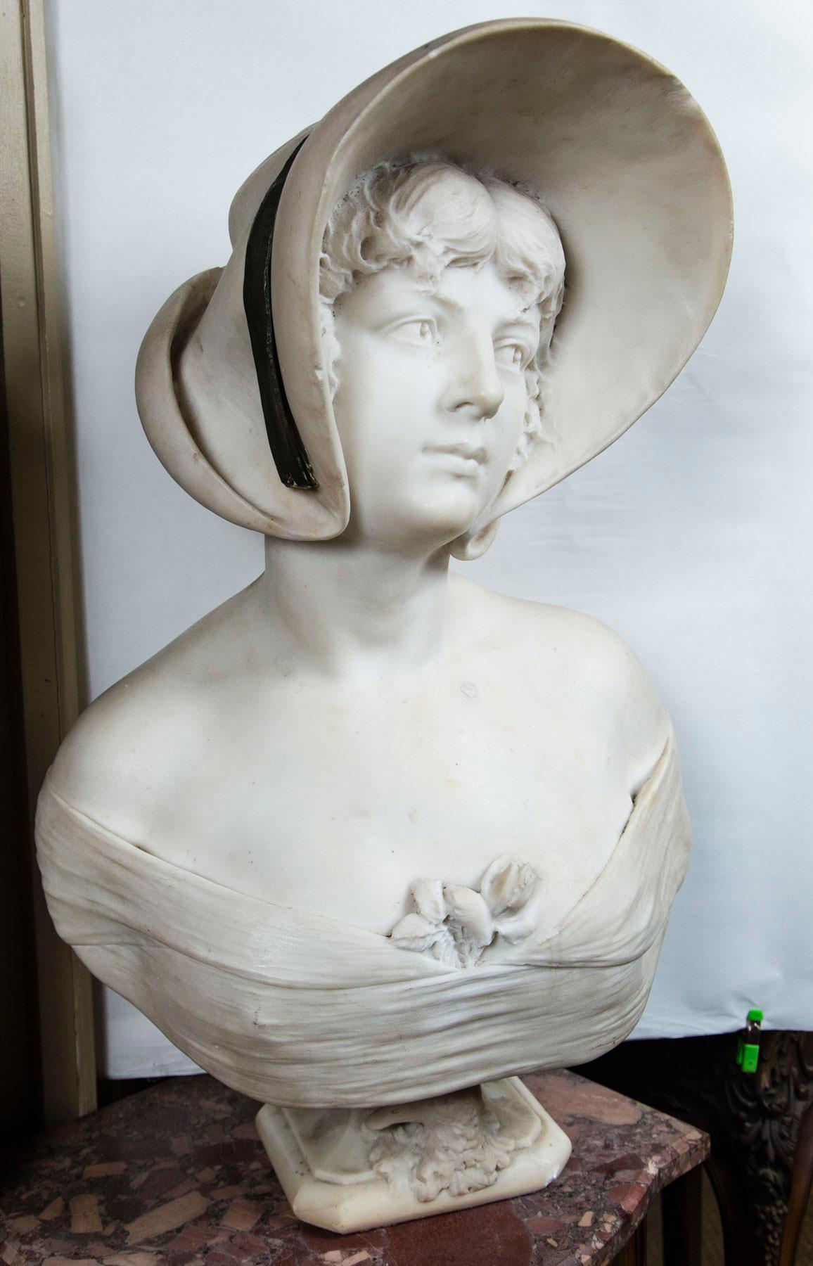 bust of a woman with a hat