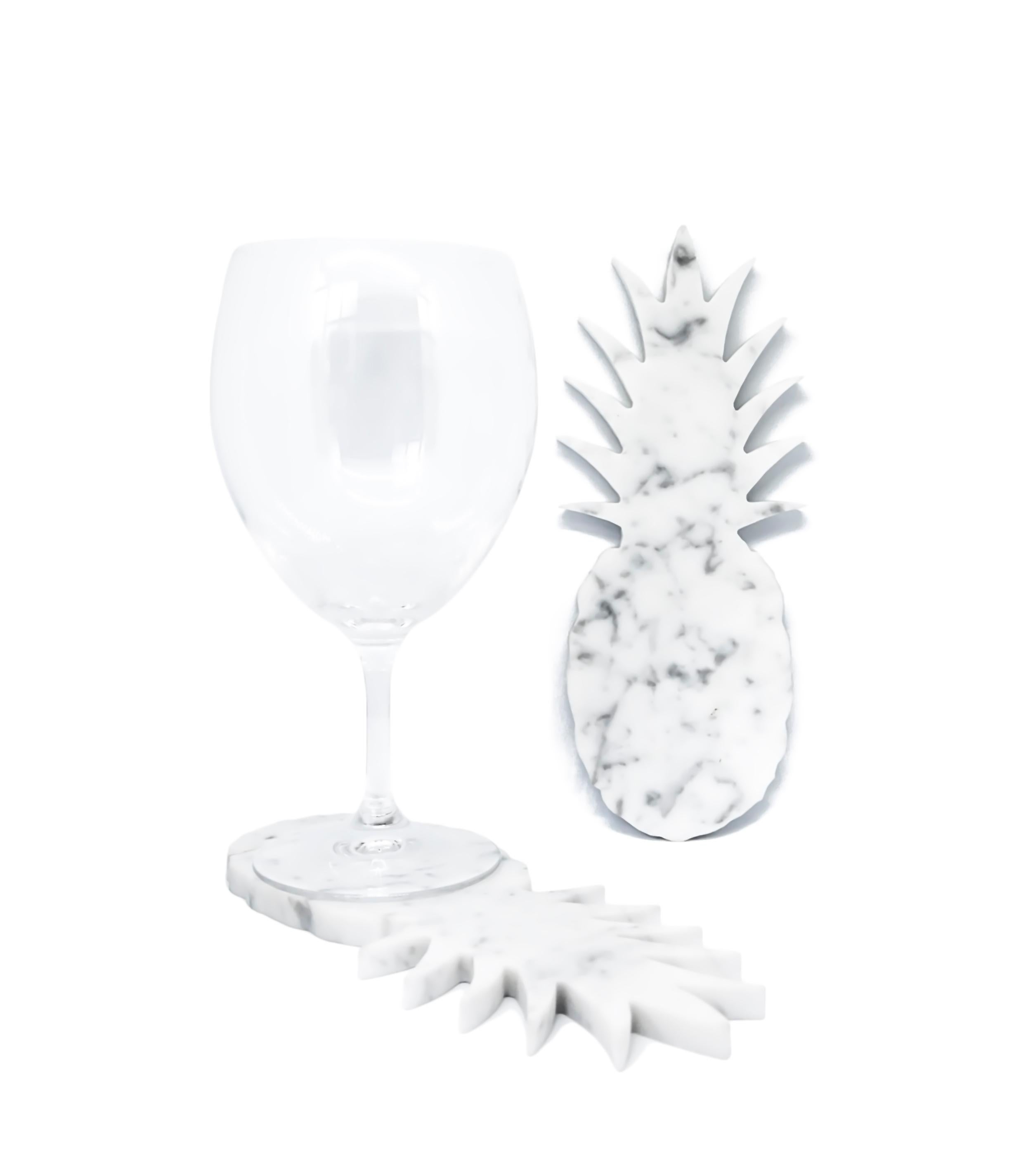White Carrara marble coaster with pineapple shape. Each piece is in a way unique (every marble block is different in veins and shades) and handmade by Italian artisans specialized over generations in processing marble. Slight variations in shape,