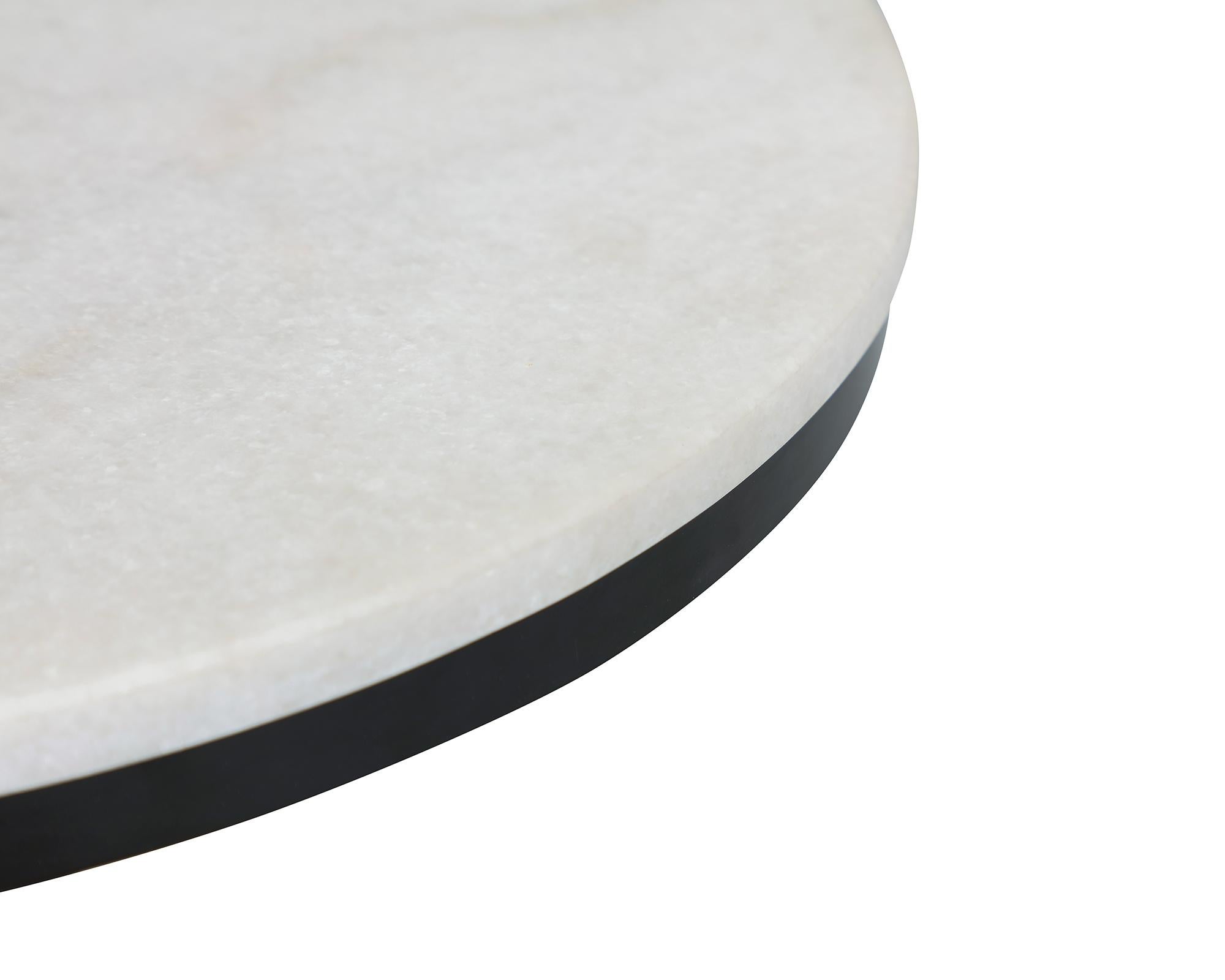 White marble and brass coffee table

Materials: White marble top, black high gloss metal base with gold metal cups
Dimensions: D 50 x H 55 cm.