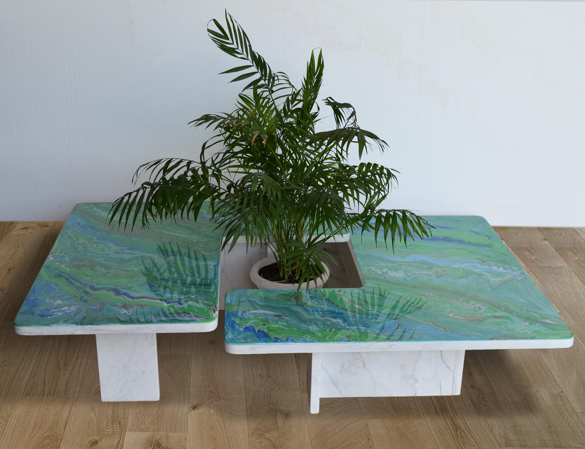 Set of two coffee tables in Italian White marble,  decorated by hand on the tops, by our scagliola skilled craftmen.
Characterized by the use of bright colors with vibrant shadows of green  , the manual workmanship of the artist is highlighted by 