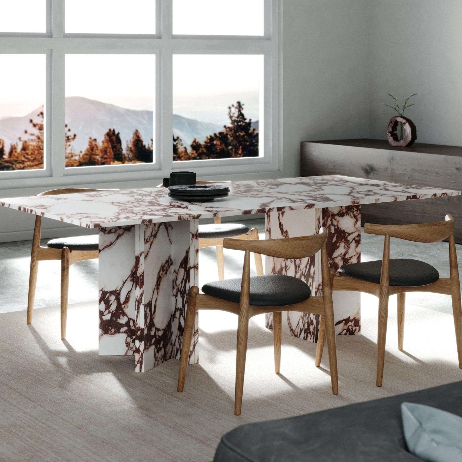 Gorgeous Dining Table in Calacata Viola Marble invites you to take a long break, without time, reinforcing the conviviality and the act of sharing in our communal daily routines. This table results from a composition of lines in rhythmic, contrast,