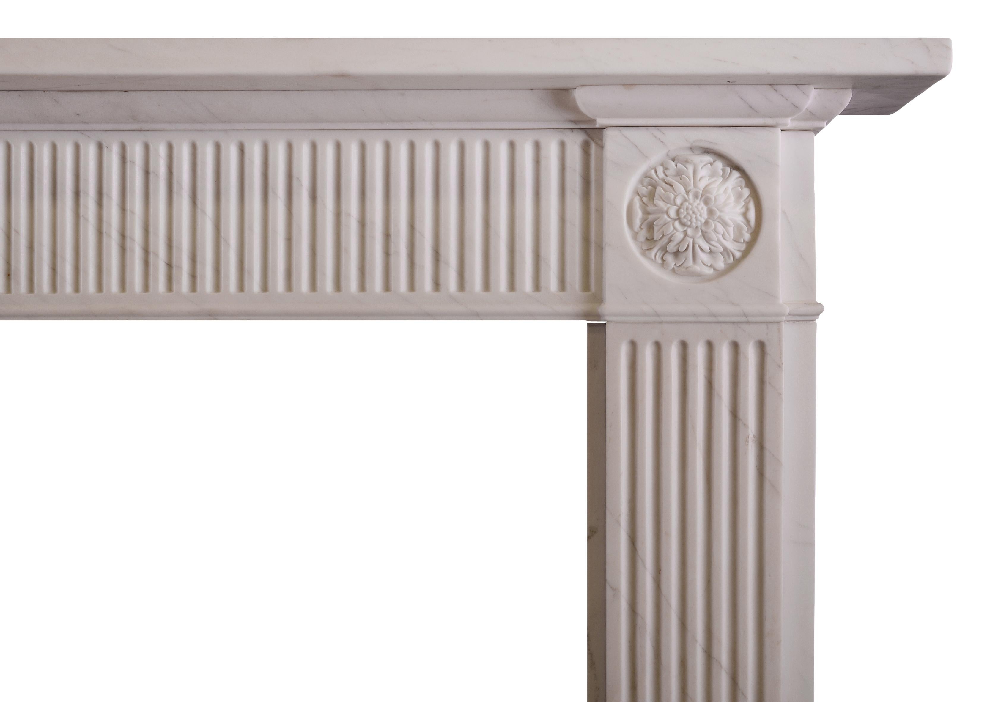A simple yet elegant white marble fireplace in the Regency style. The fluted jambs surmounted by carved rosette paterae above. The frieze with flutes throughout. Moulded shelf above. English, modern.


Shelf width: 1534 mm / 60 5/8 in
Overall