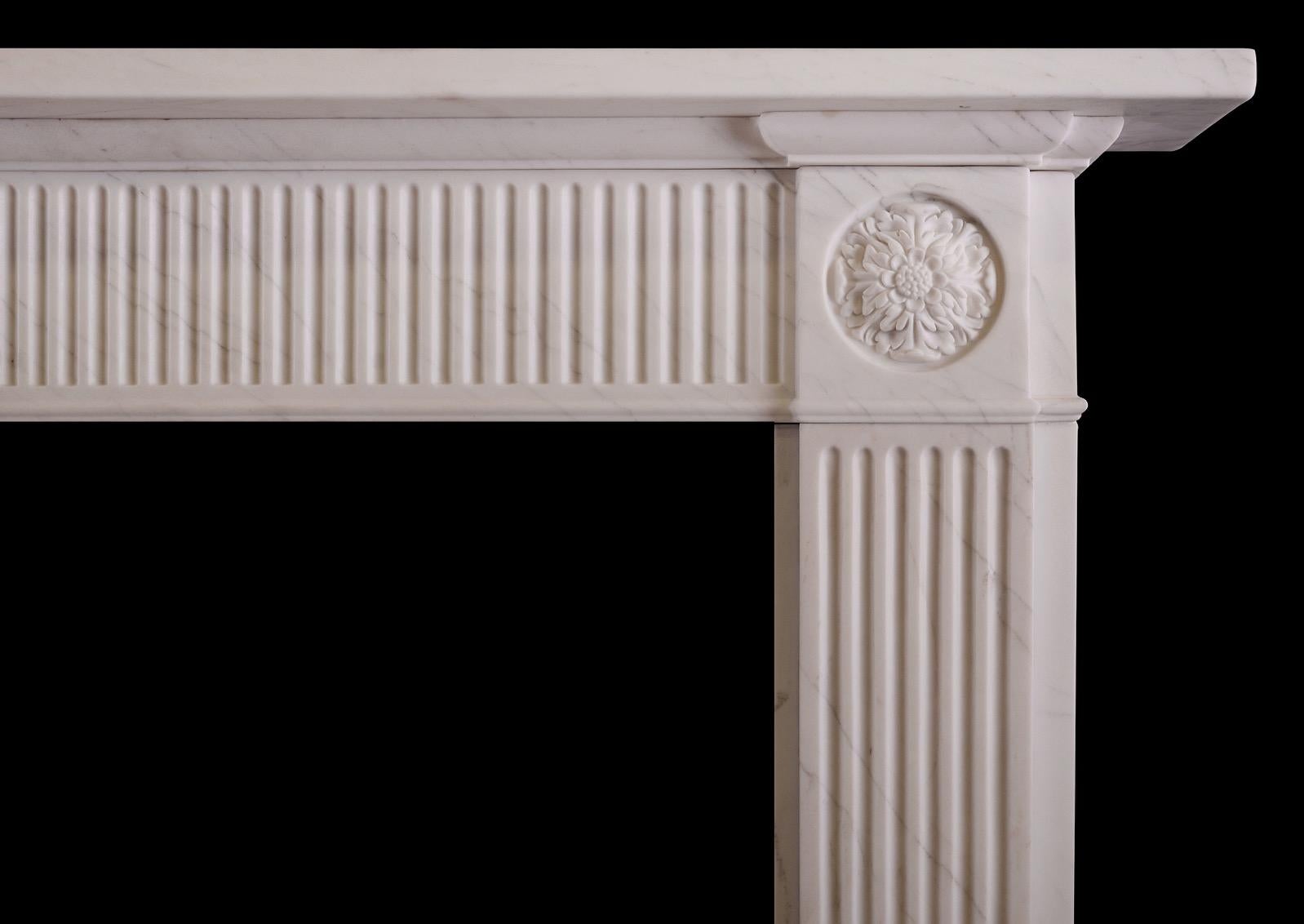 A simple yet elegant white marble fireplace in the Regency style. The fluted jambs surmounted by carved rosette paterae above. The frieze with flutes throughout. Moulded shelf above. English, modern.


Measures: Shelf width: 1534 mm / 60 5/8