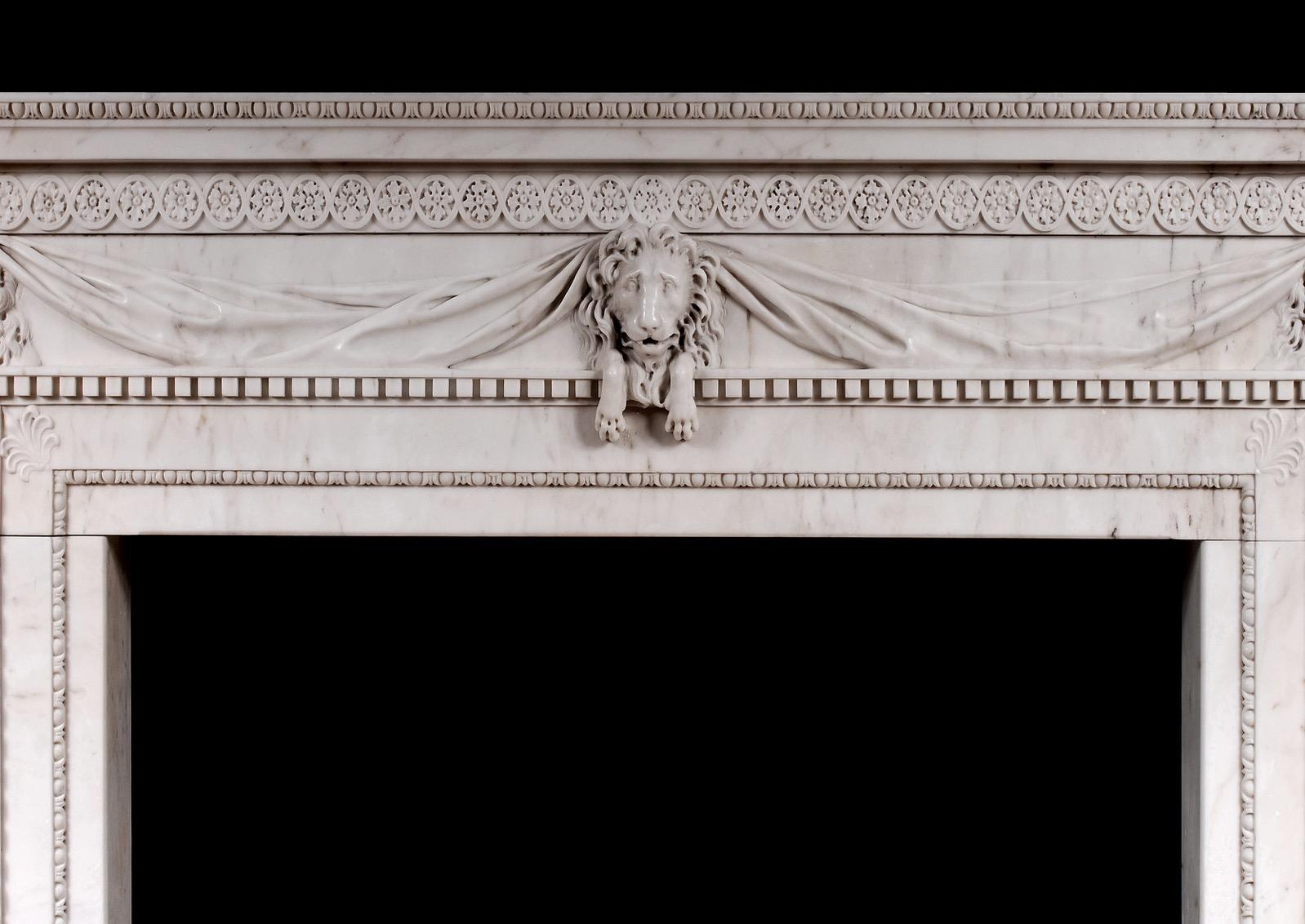 Very good quality English, white marble fireplace in the late Georgian style. The frieze with carved lion masks, drapery and dentils, the jambs with delicate inner moulding of egg-and-dart and carved acanthus leaves to corners. The shelf with carved